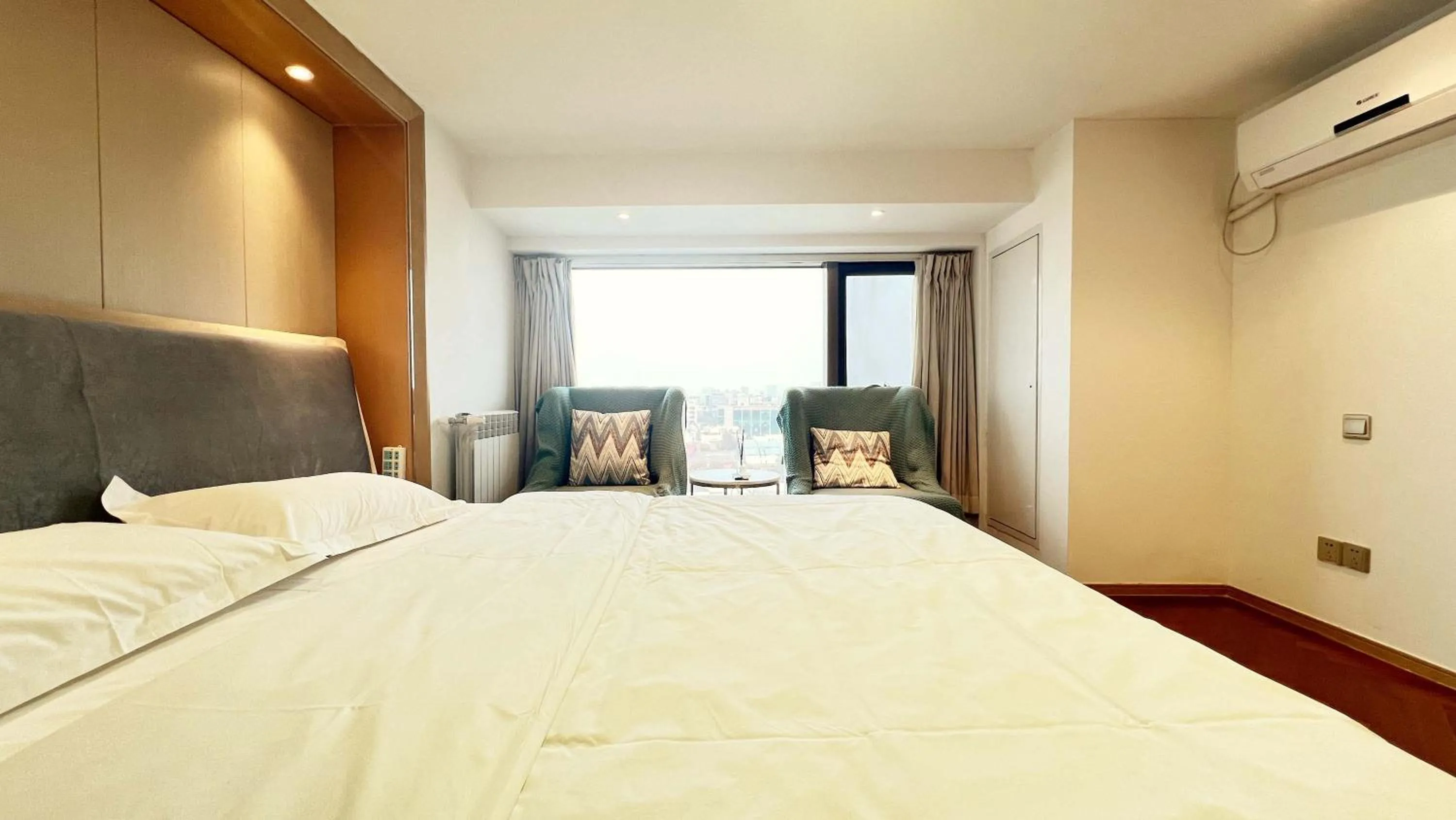 Bed in Hongqiao Aegean Sea LOFT Apartment