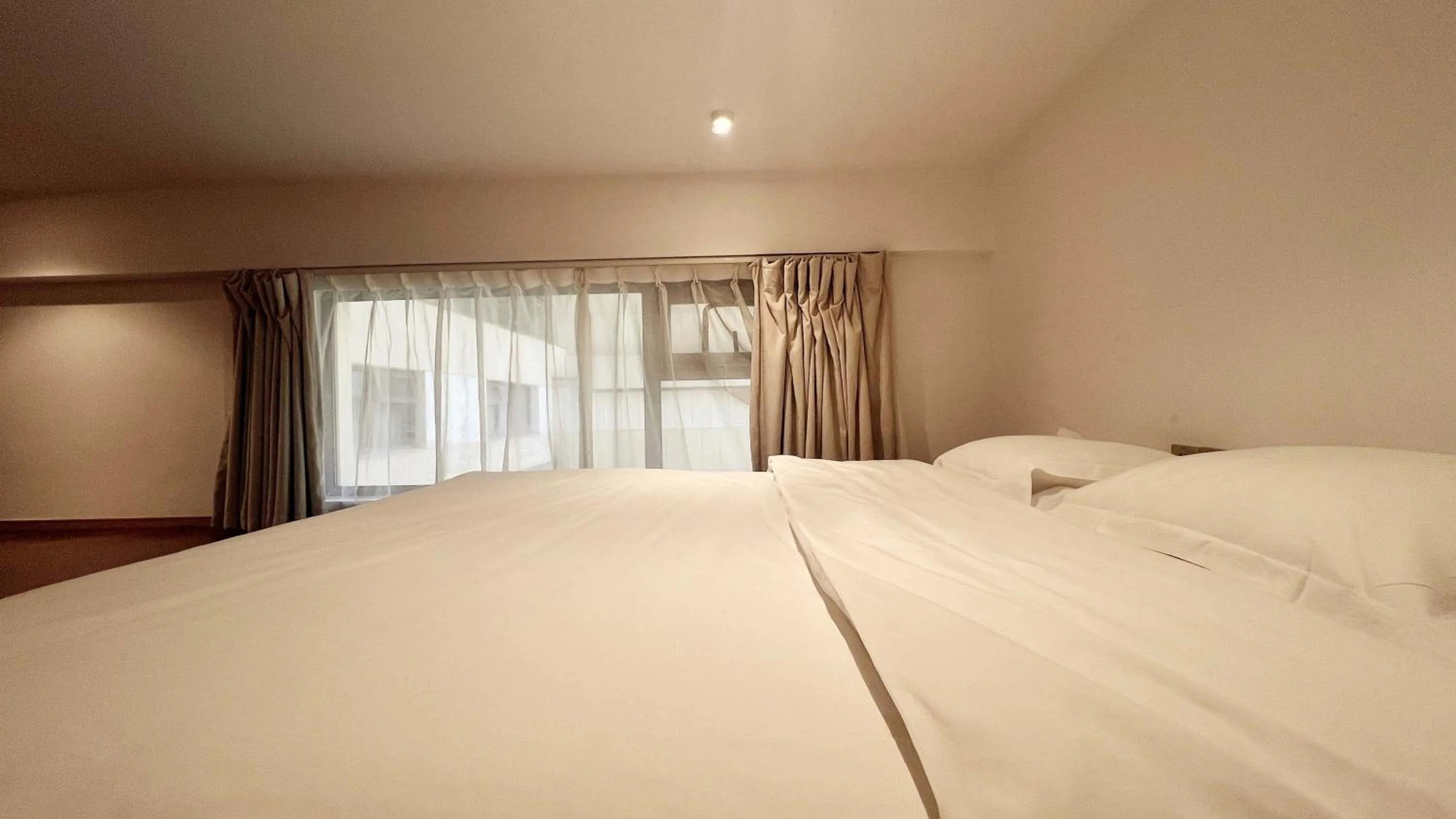Bed in Hongqiao Aegean Sea LOFT Apartment