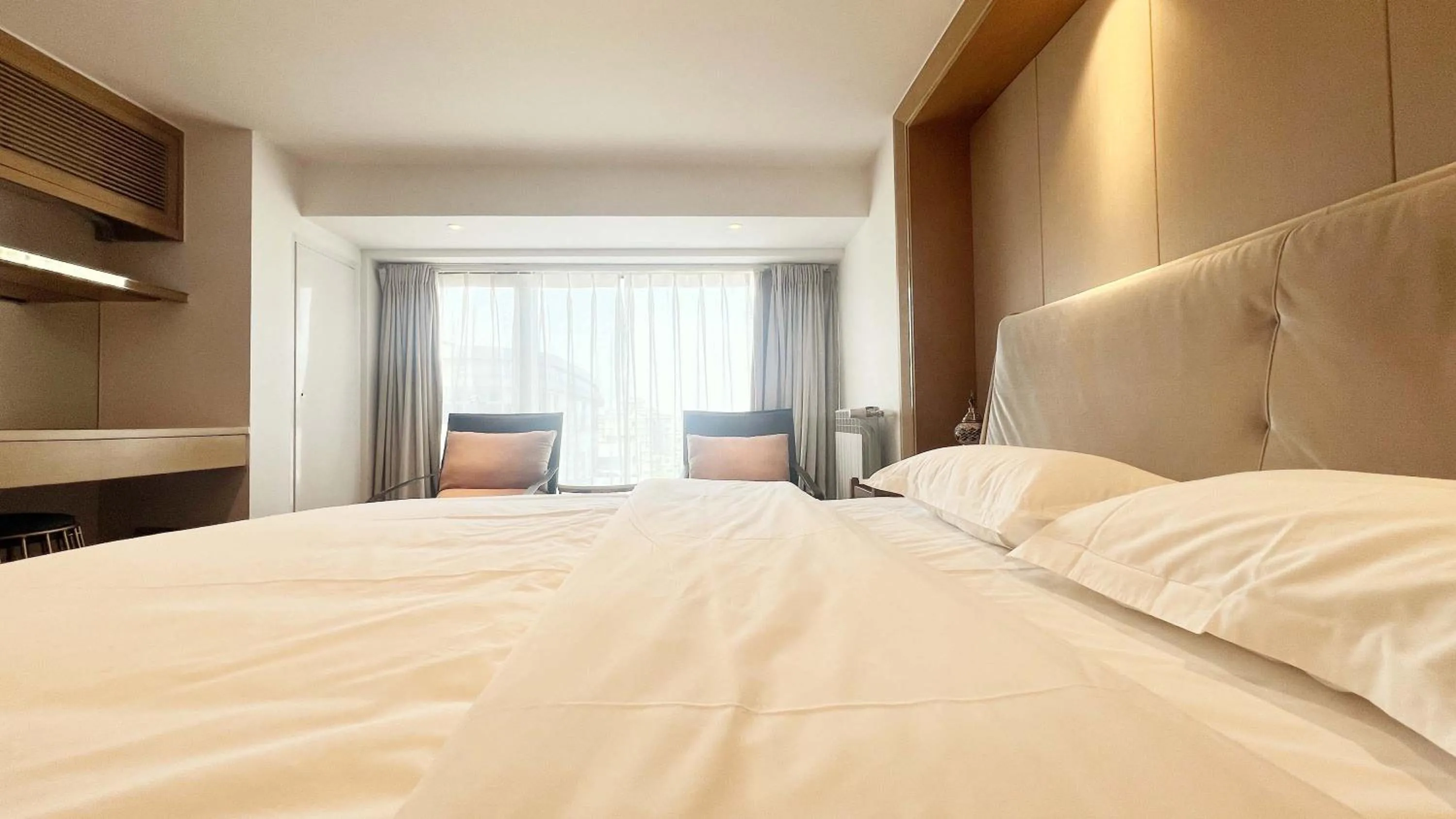Bed in Hongqiao Aegean Sea LOFT Apartment