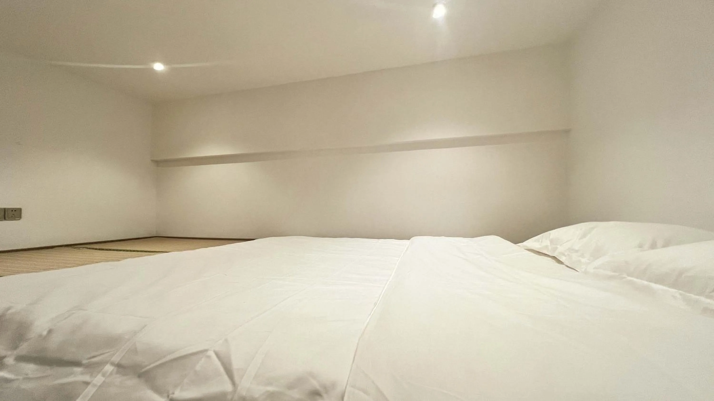 Bed in Hongqiao Aegean Sea LOFT Apartment
