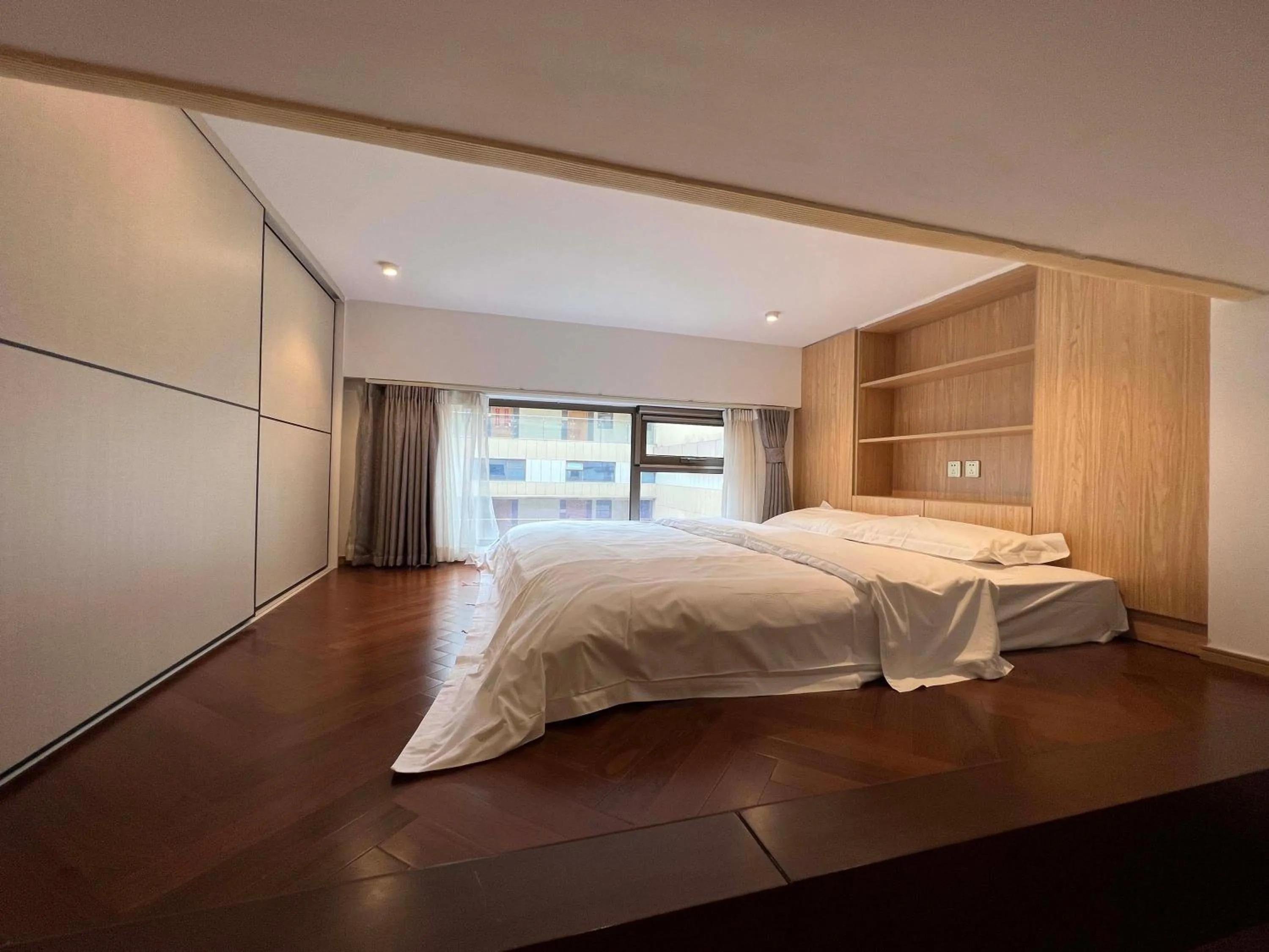 Bed in Hongqiao Aegean Sea LOFT Apartment