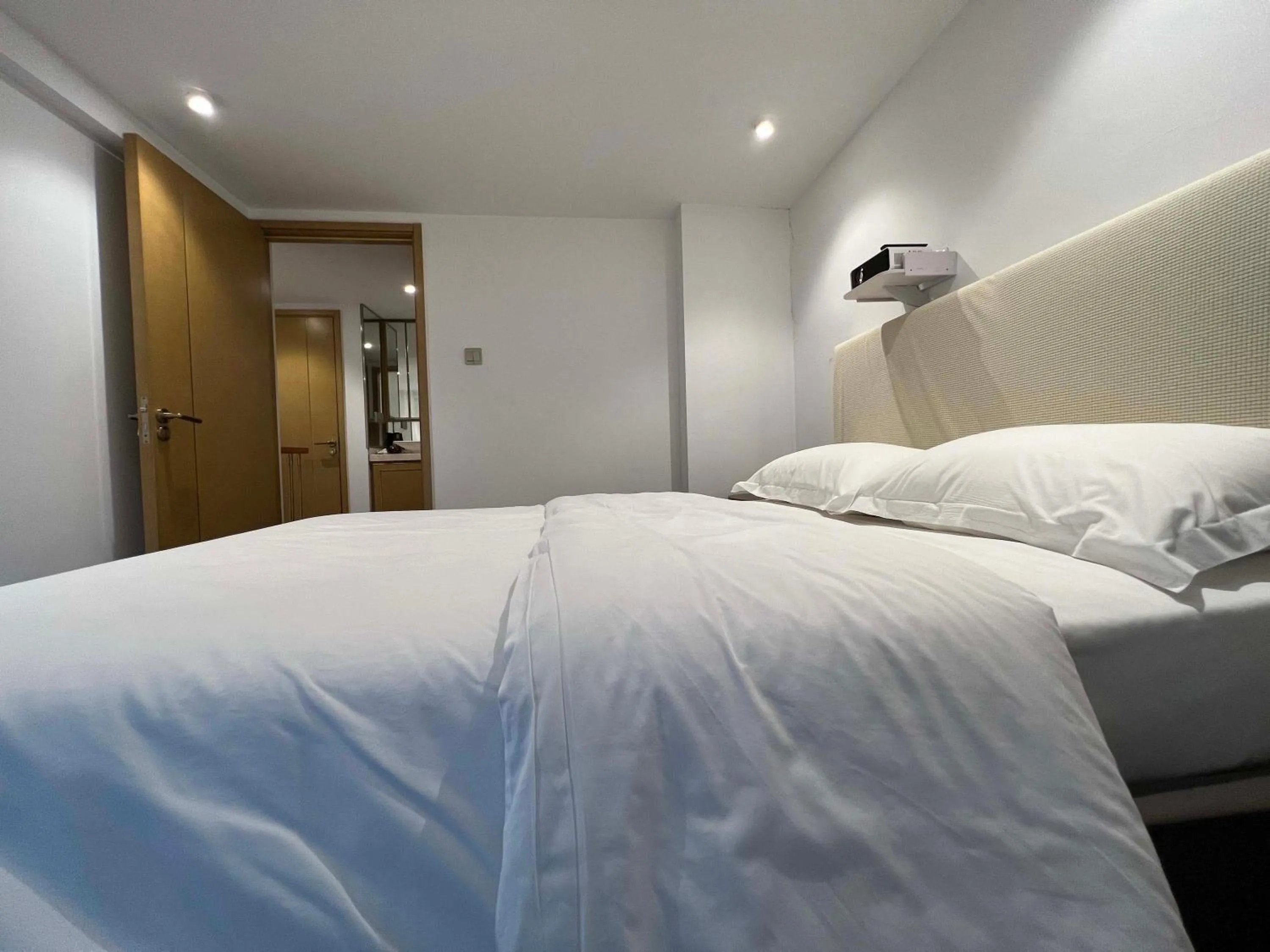 Bed in Hongqiao Aegean Sea LOFT Apartment