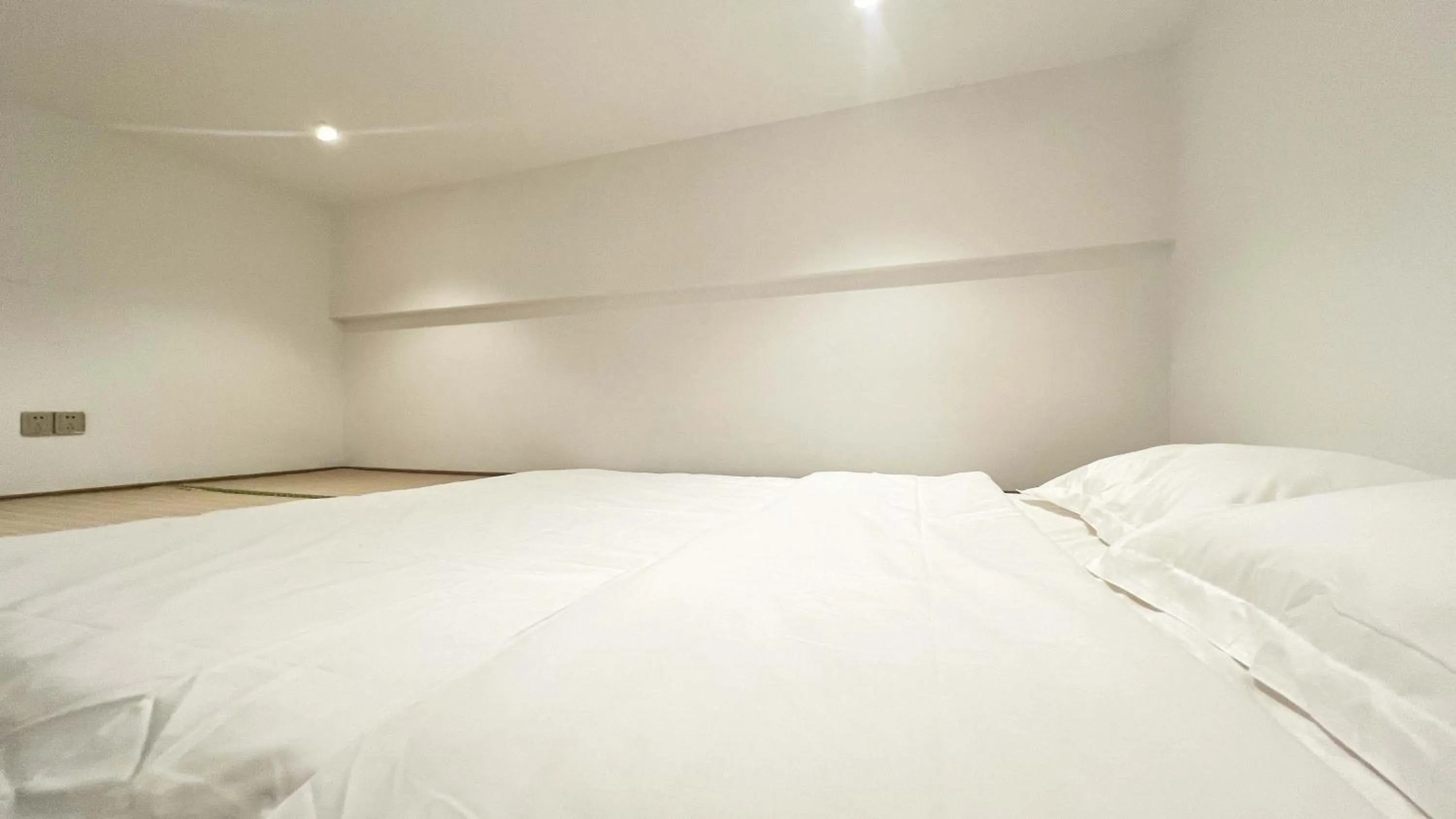 Bed in Hongqiao Aegean Sea LOFT Apartment