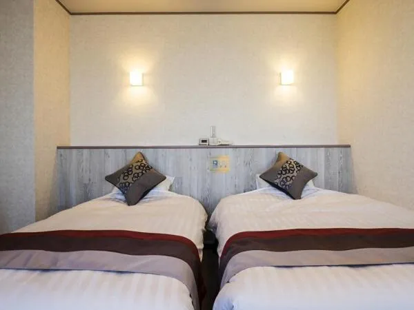 Bed in Hotel Areaone Hiroshima Wing