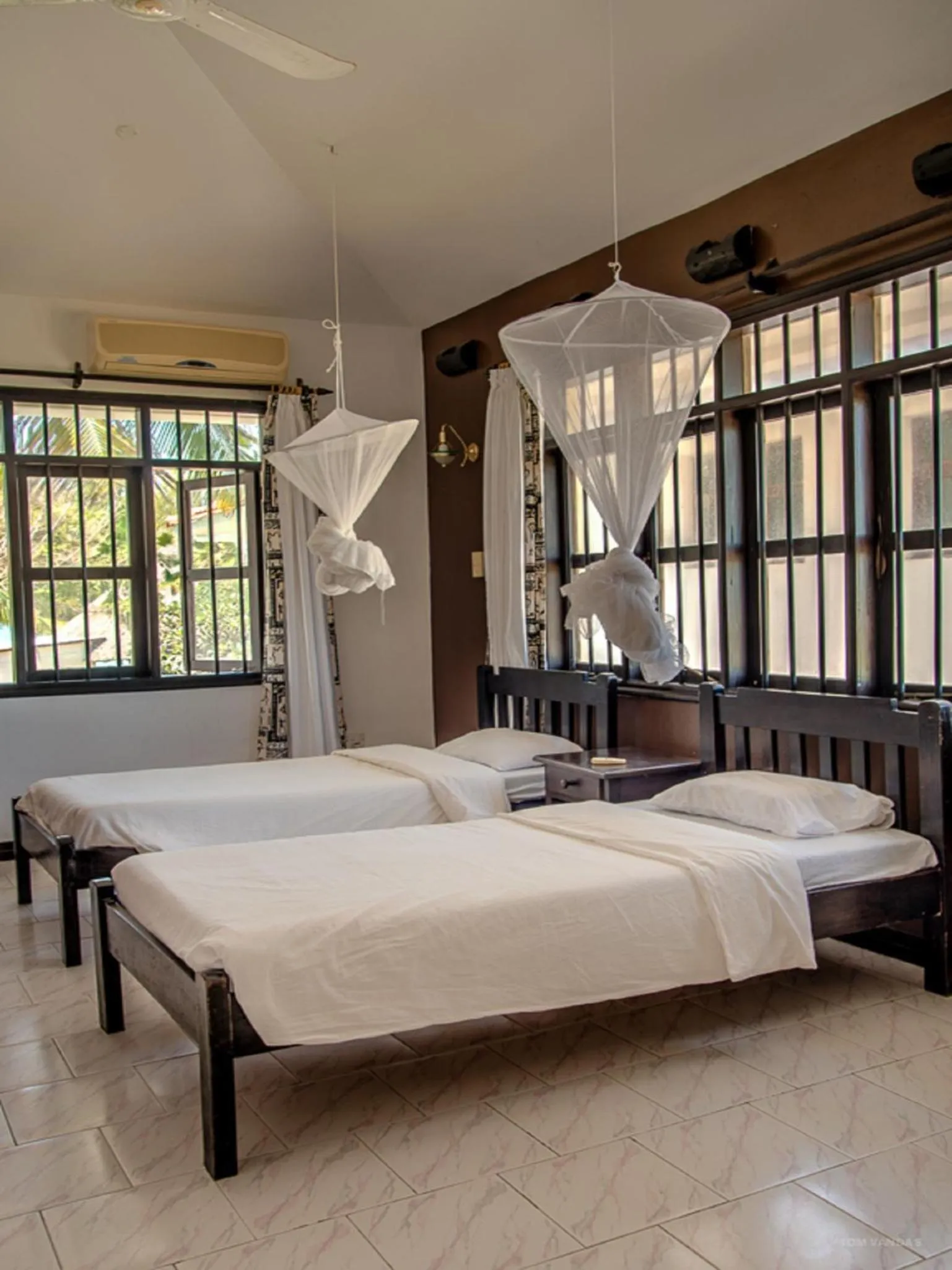 Bed in Bahari Dhow Beach Villas