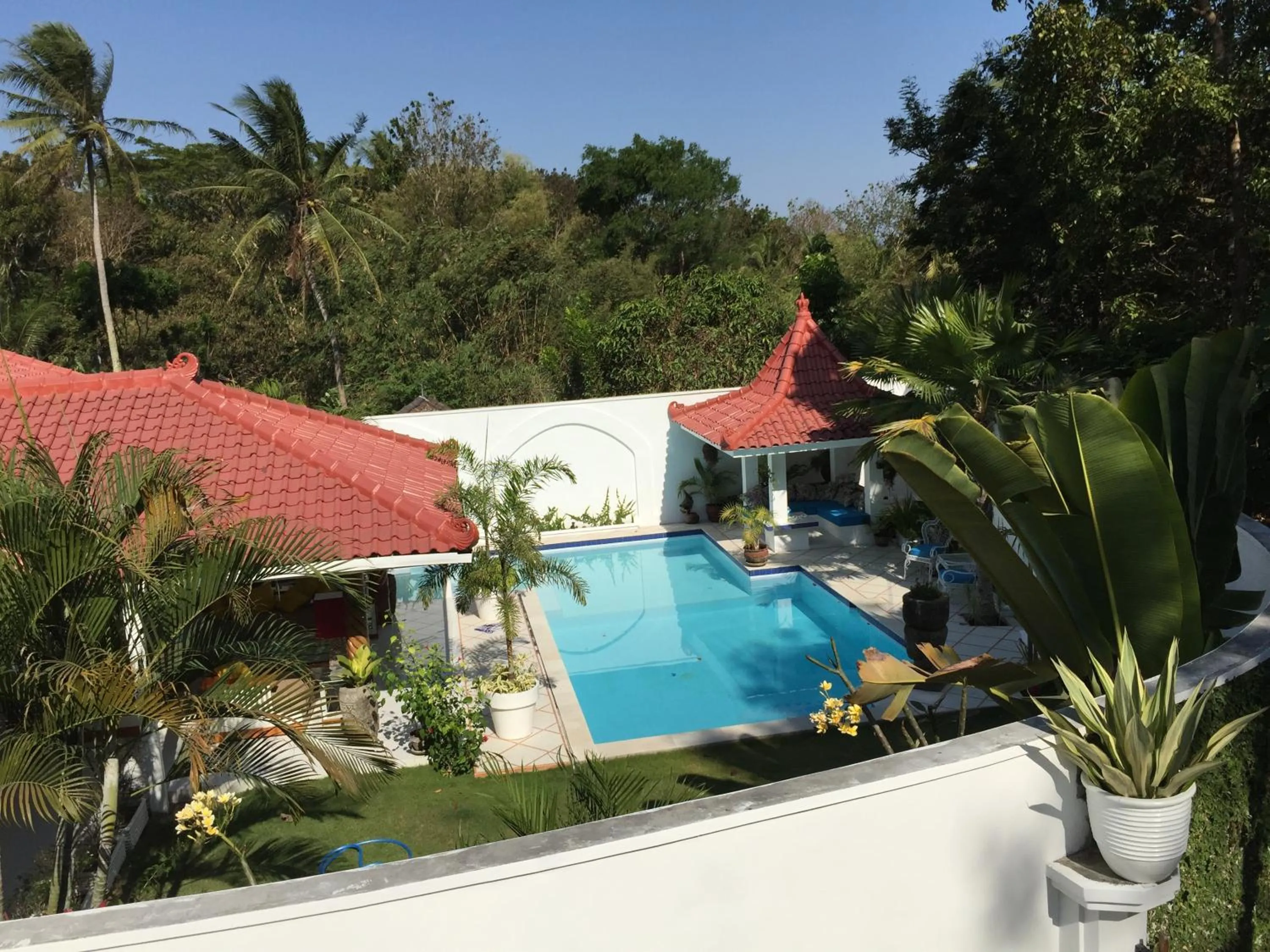 Text overlay in Yogyakarta Tropicana Villa