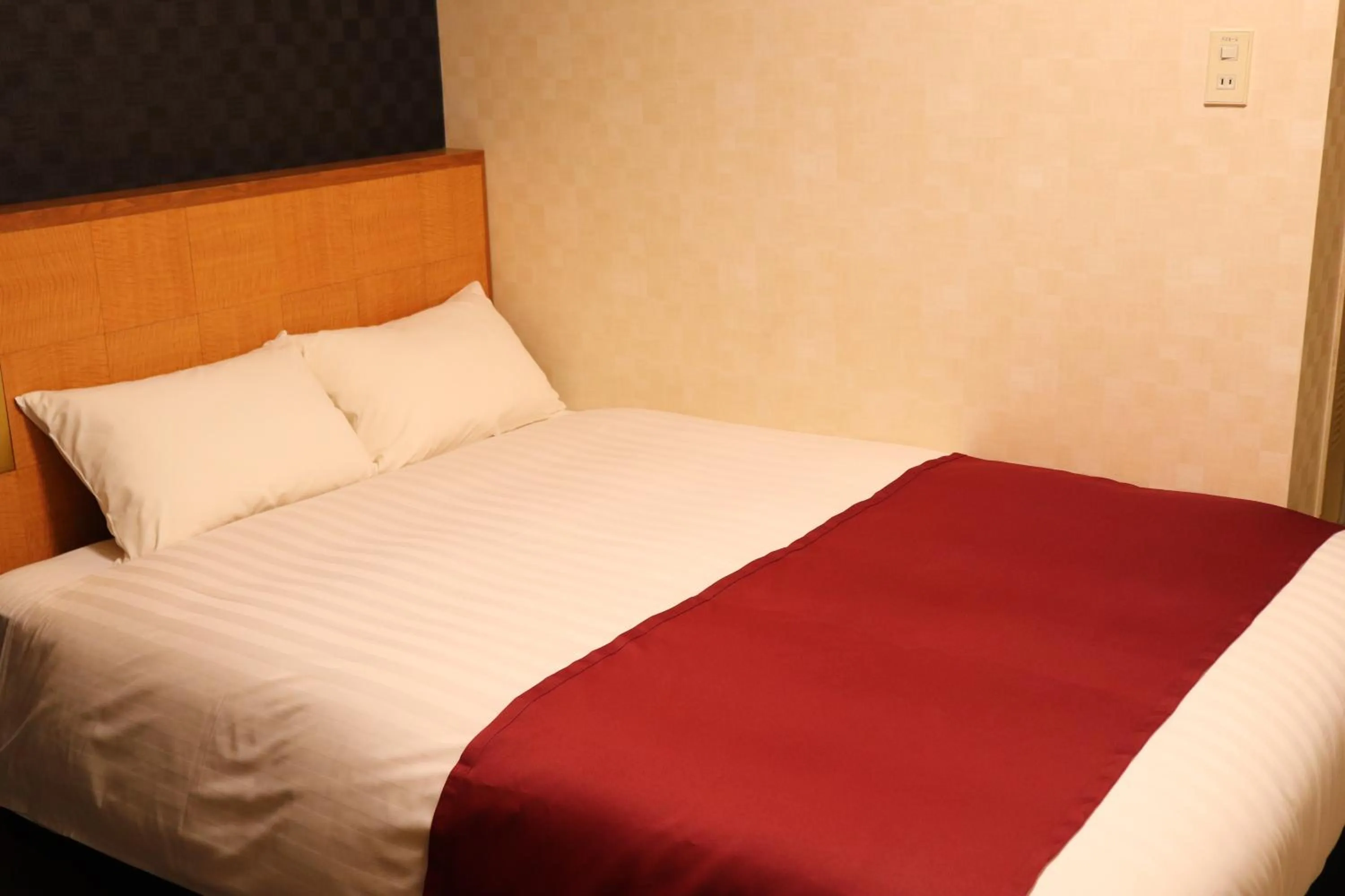 Bed in Pioland Hotel