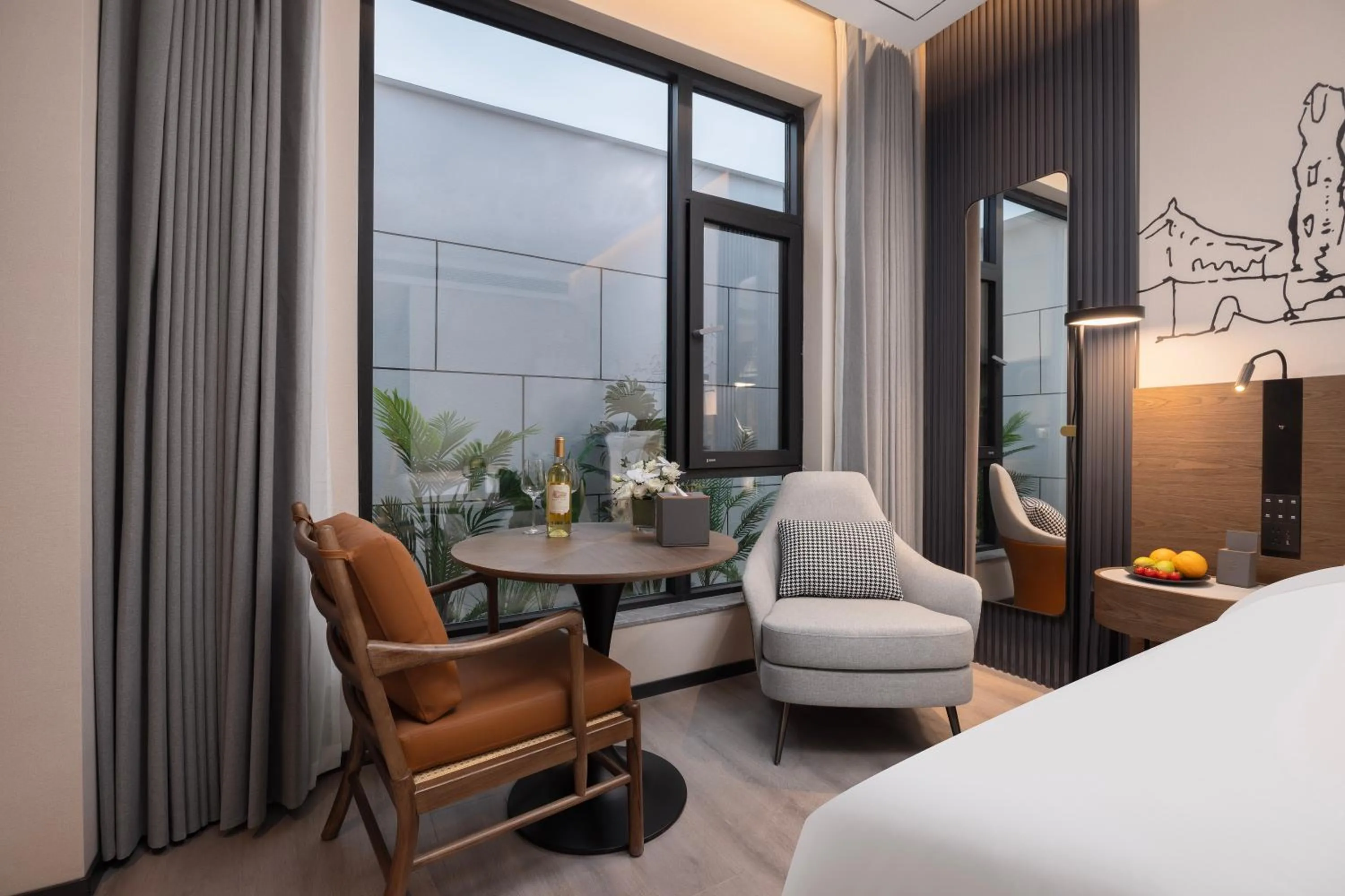 Seating area, Bed in UrCove by Hyatt Xi'an Bell Tower Huimin Street Hotel