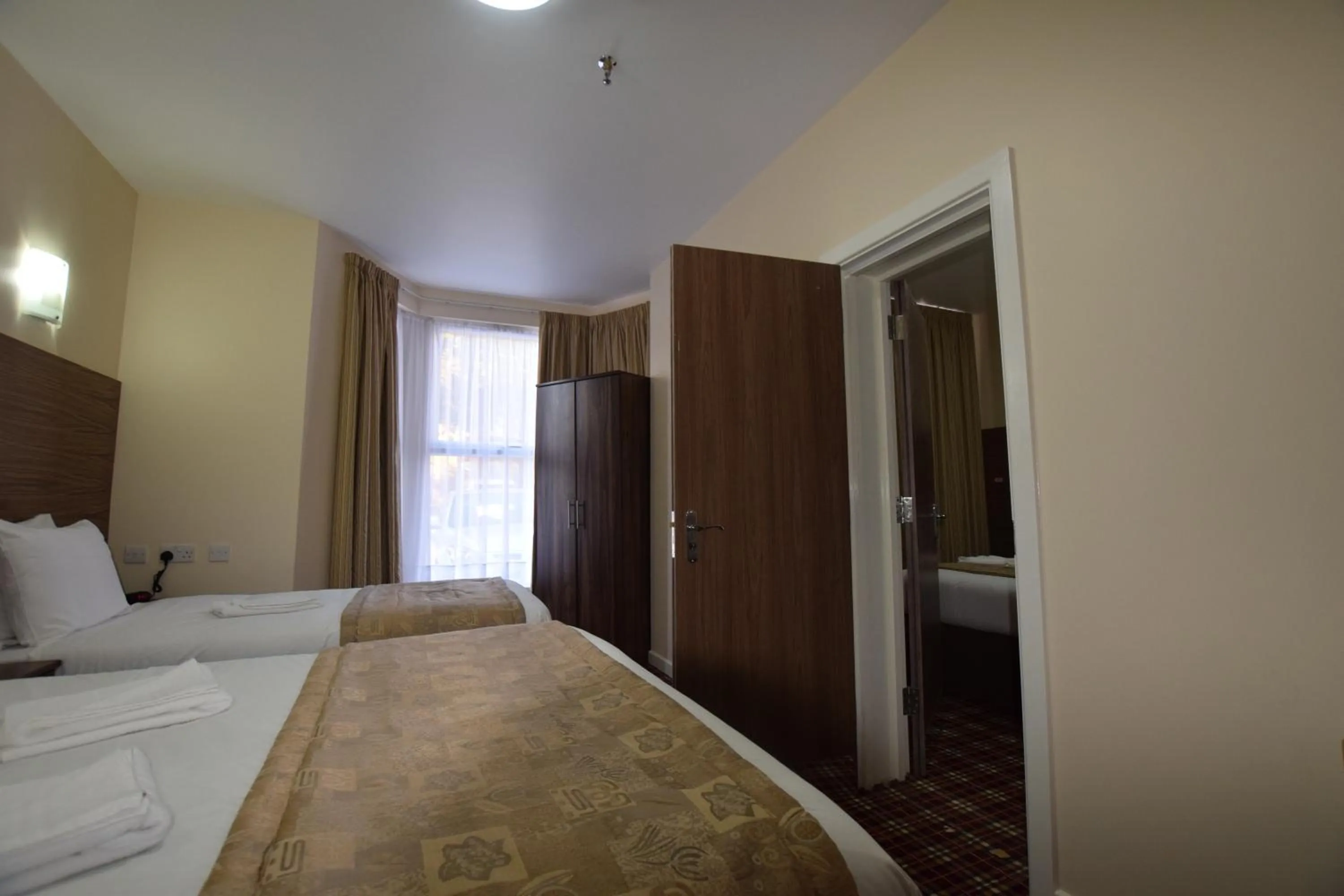 Photo of the whole room, Bed in Lucky 8 Hotel