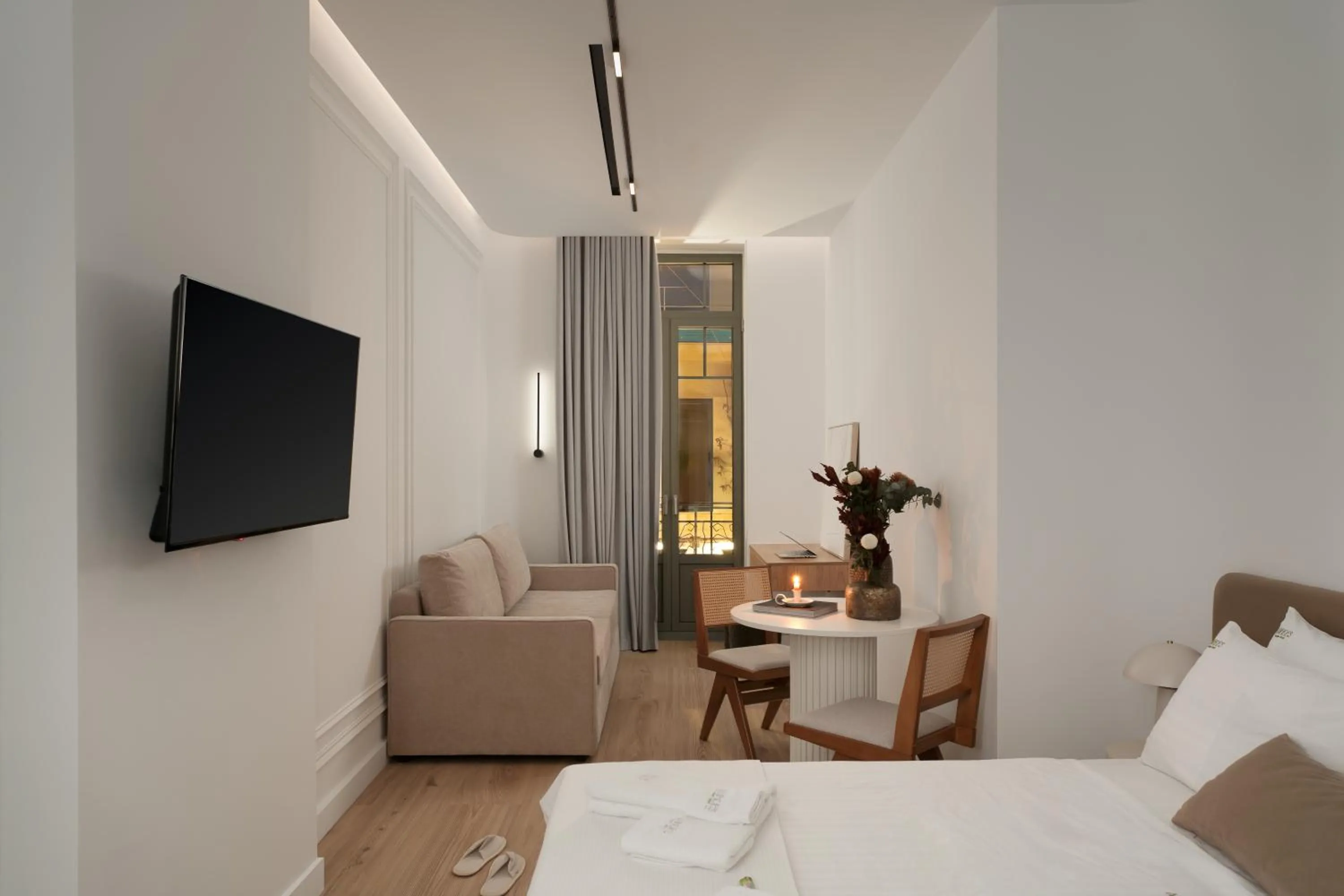 Communal lounge/ TV room, Bed in Anfides Boutique Hotel