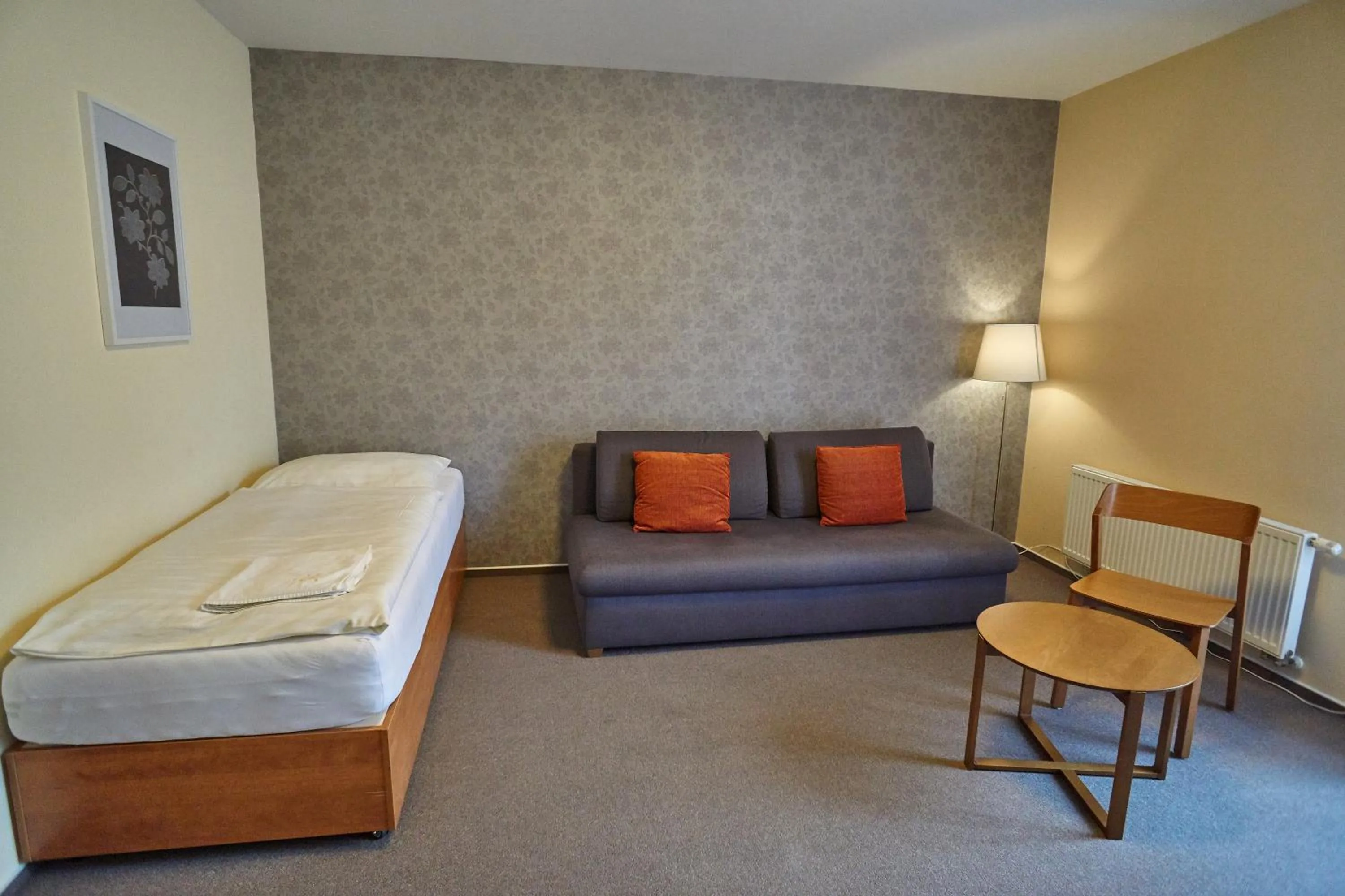 Seating area, Bed in Hotel Toč