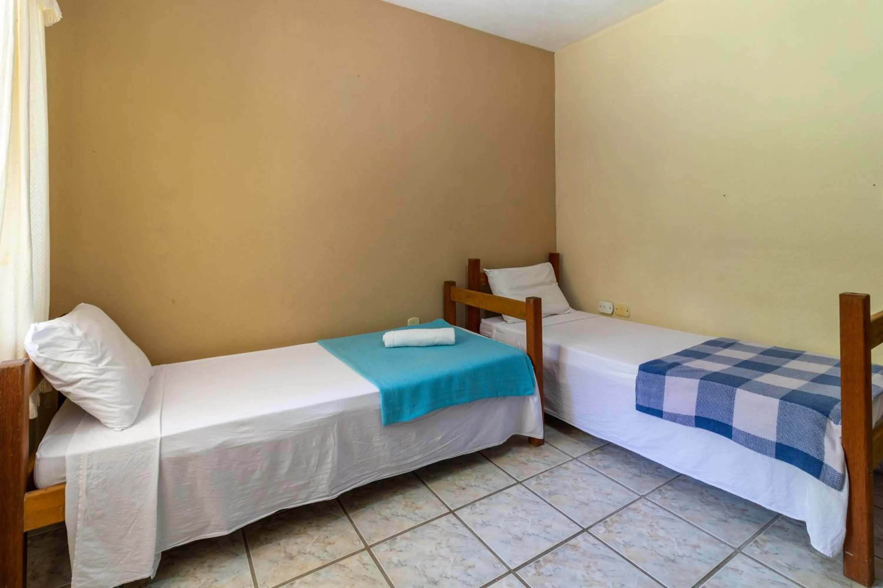 Bed in Pousada Recanto da Terra