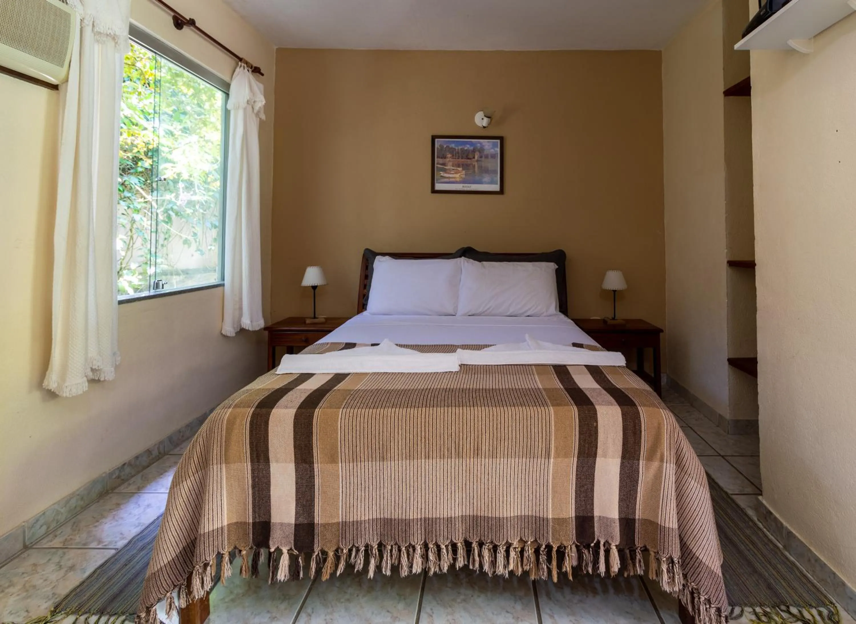 Bed in Pousada Recanto da Terra