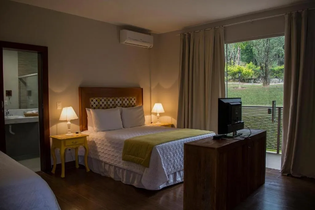 Bed in Pousada Recanto das Araras