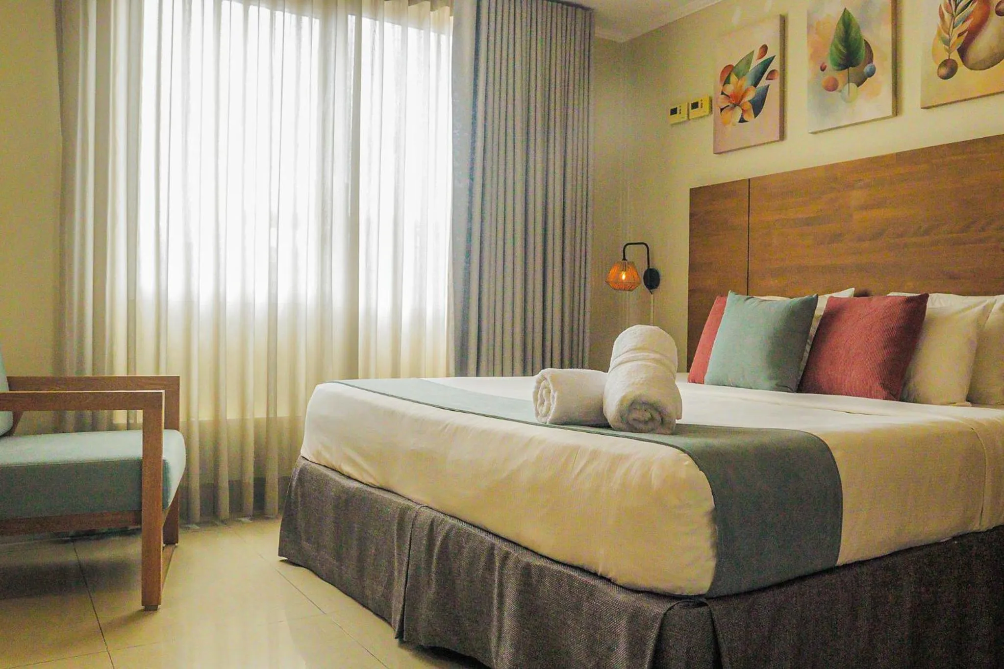 Bed in Majestic City Suites & Beach Hotel