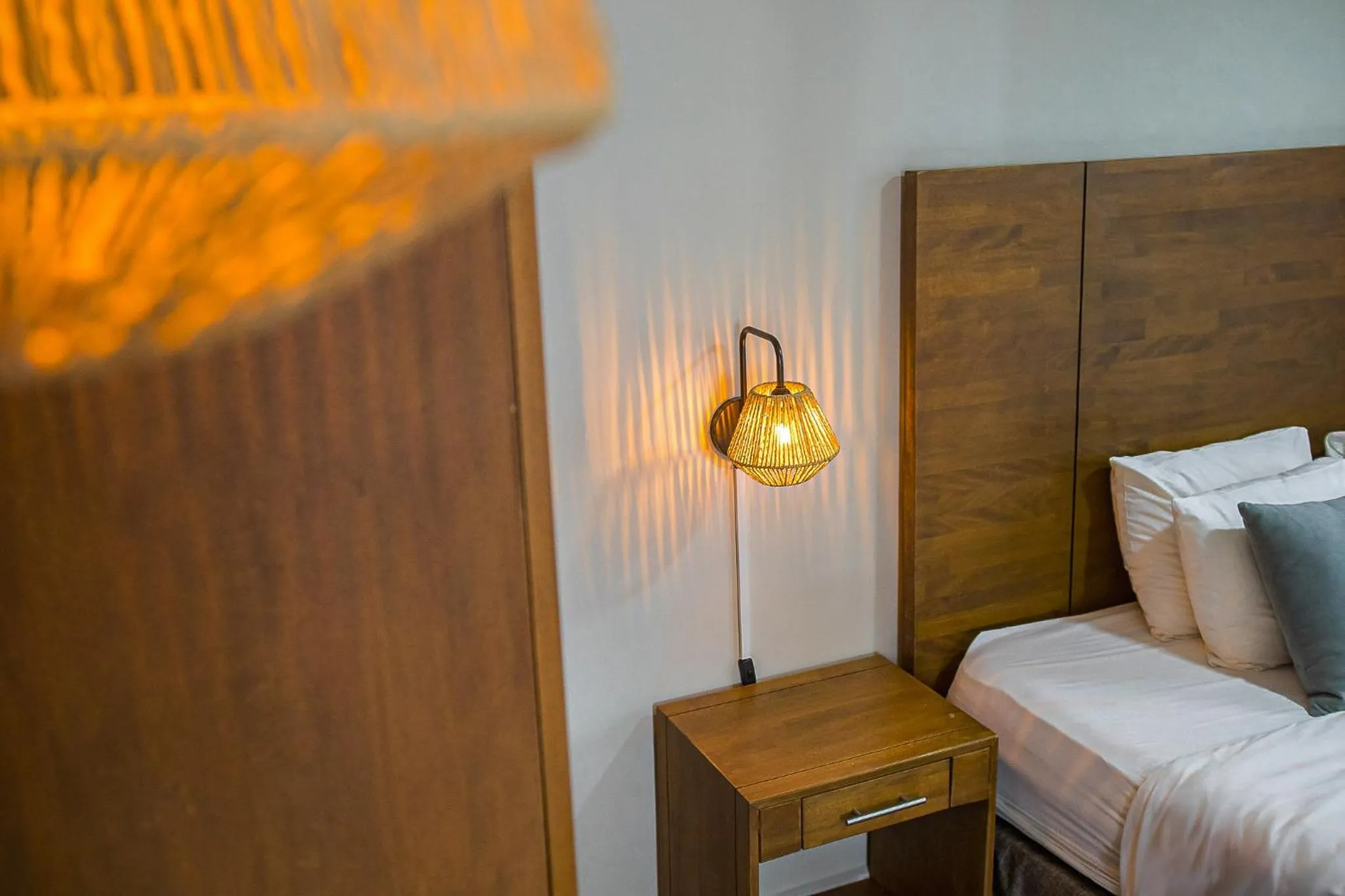 Bed in Majestic City Suites & Beach Hotel