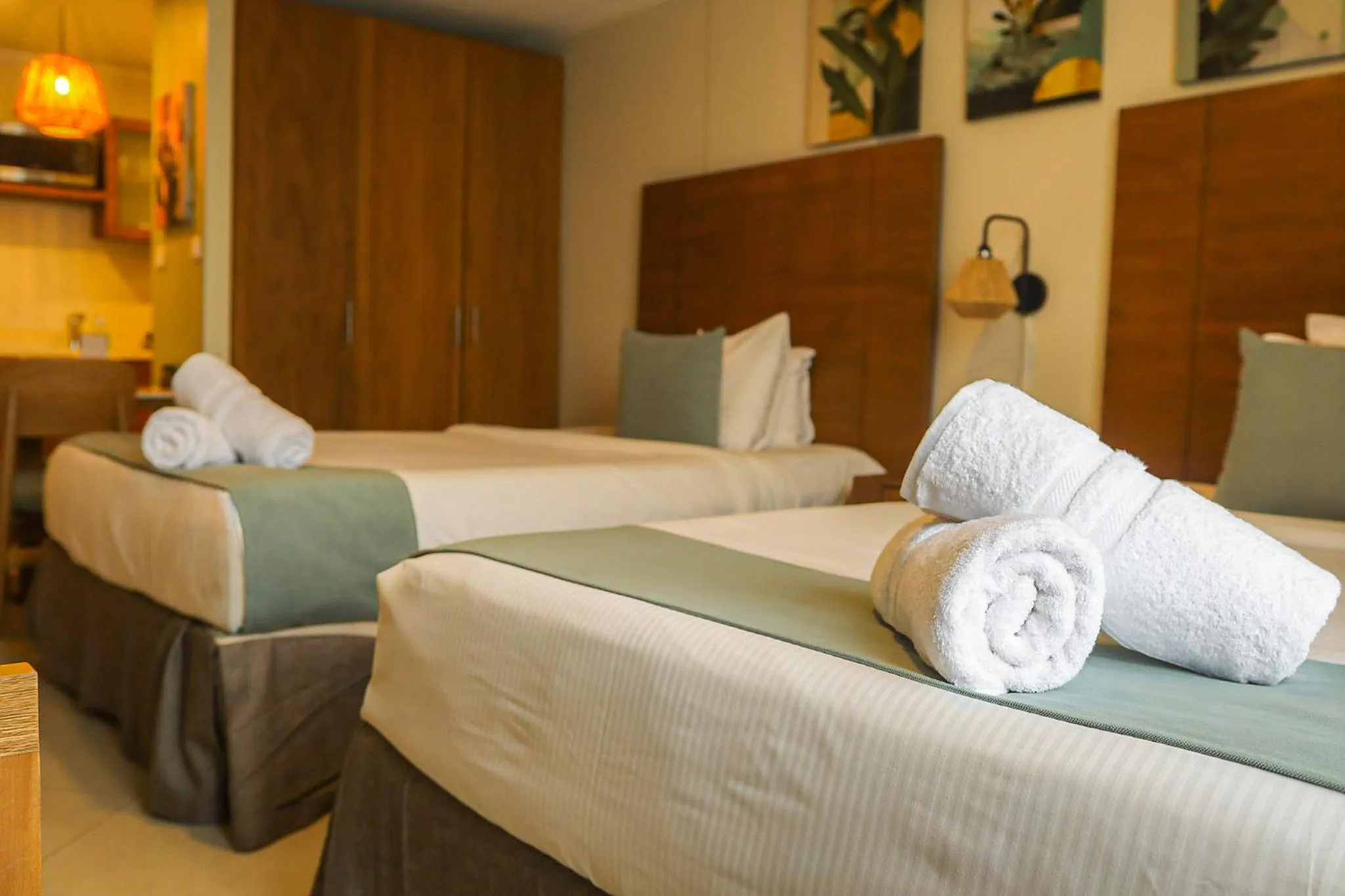 Bed in Majestic City Suites & Beach Hotel