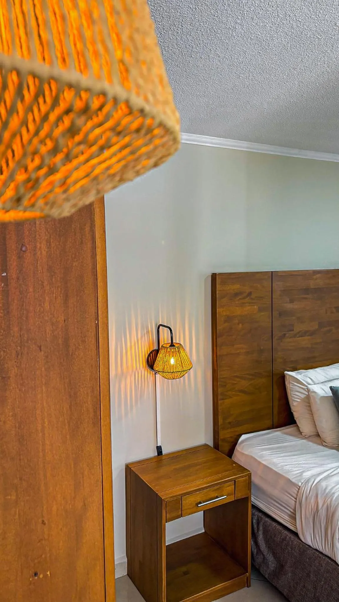 Bed in Majestic City Suites & Beach Hotel