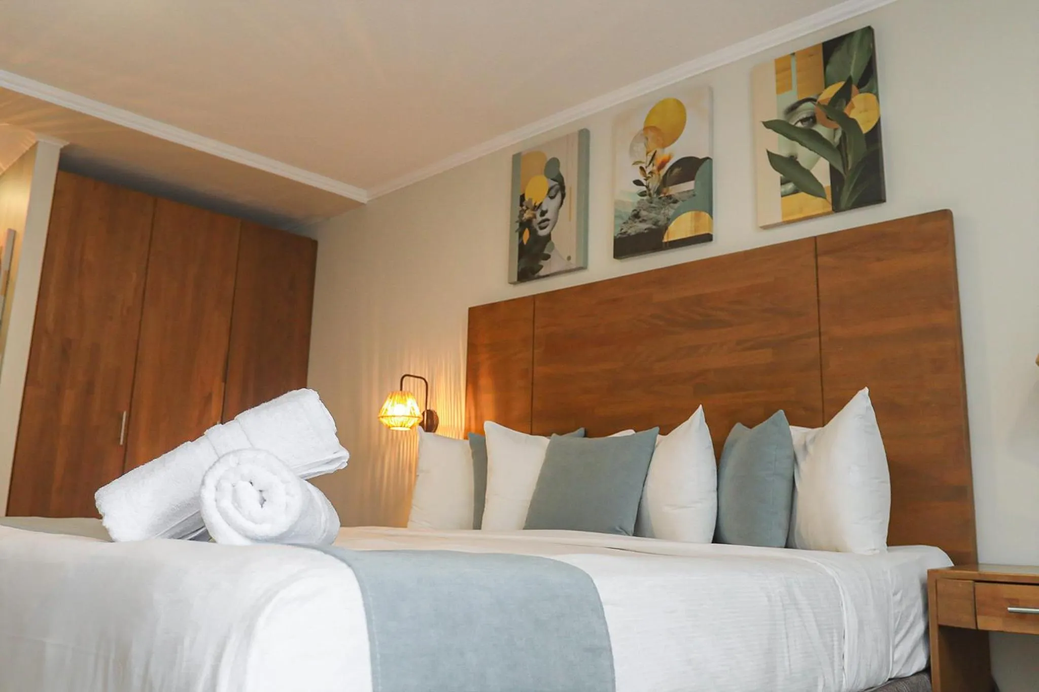 Bed in Majestic City Suites & Beach Hotel