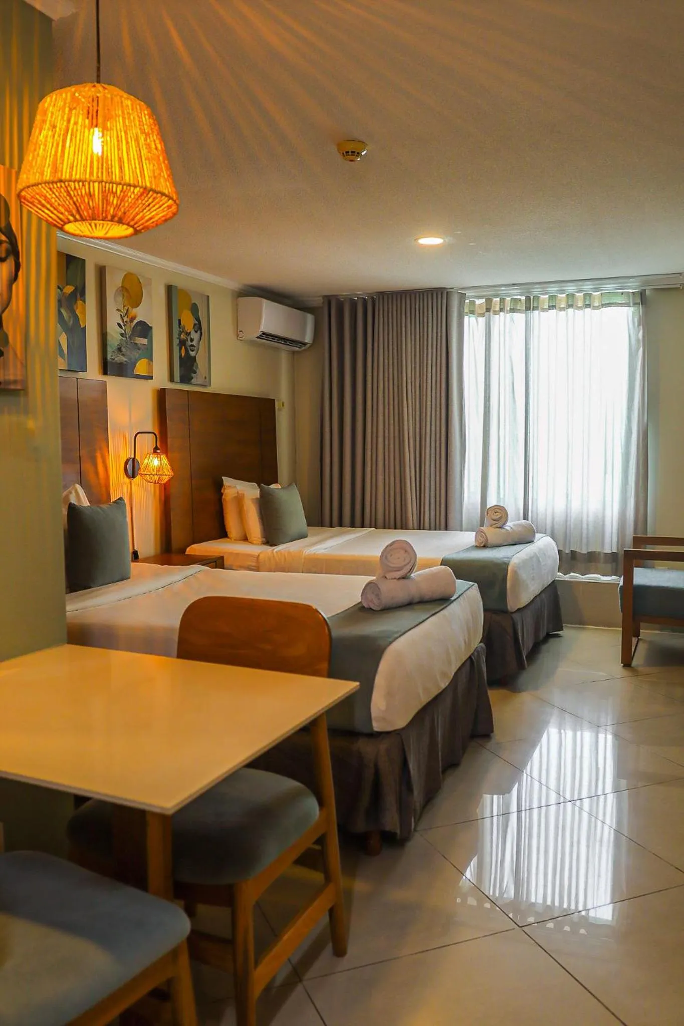 Bed in Majestic City Suites & Beach Hotel