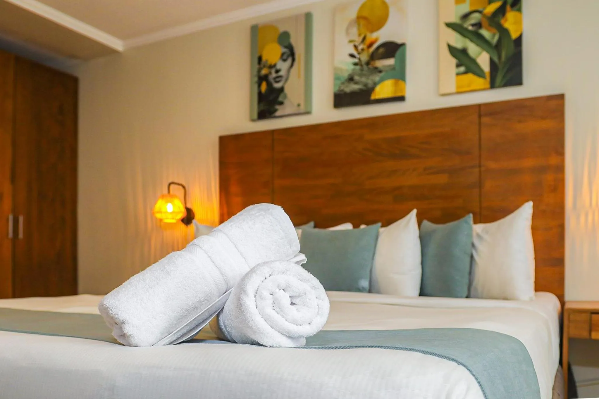 Bed in Majestic City Suites & Beach Hotel