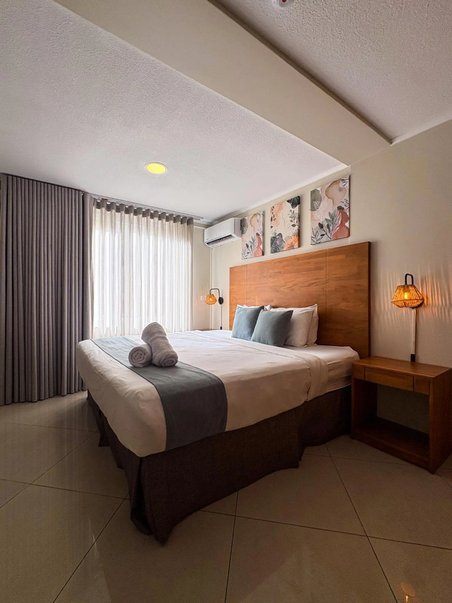 Bed in Majestic City Suites & Beach Hotel