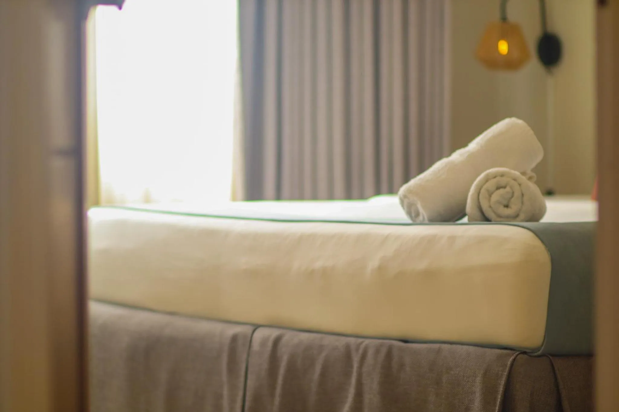 Bed in Majestic City Suites & Beach Hotel