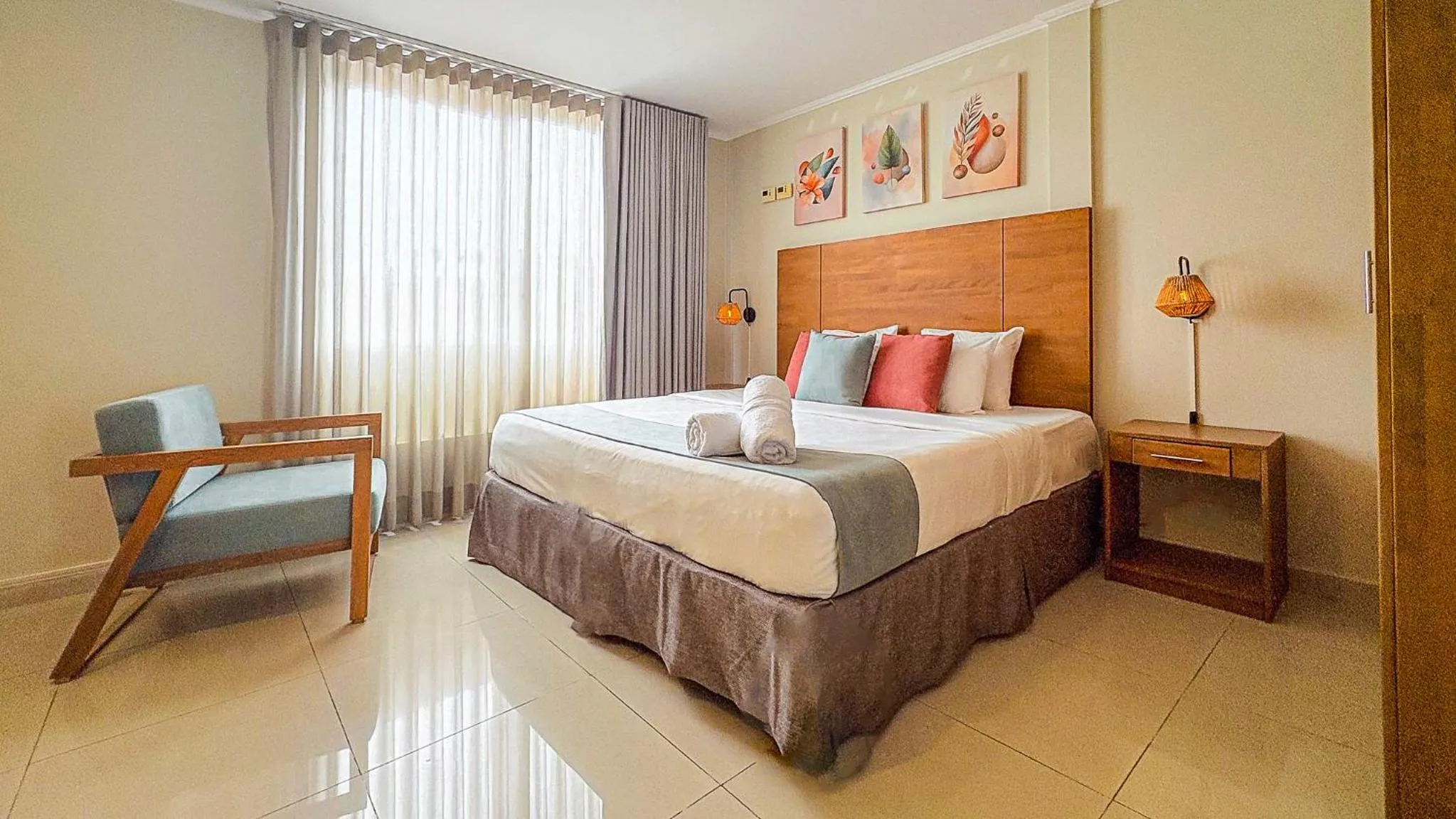 Bed in Majestic City Suites & Beach Hotel