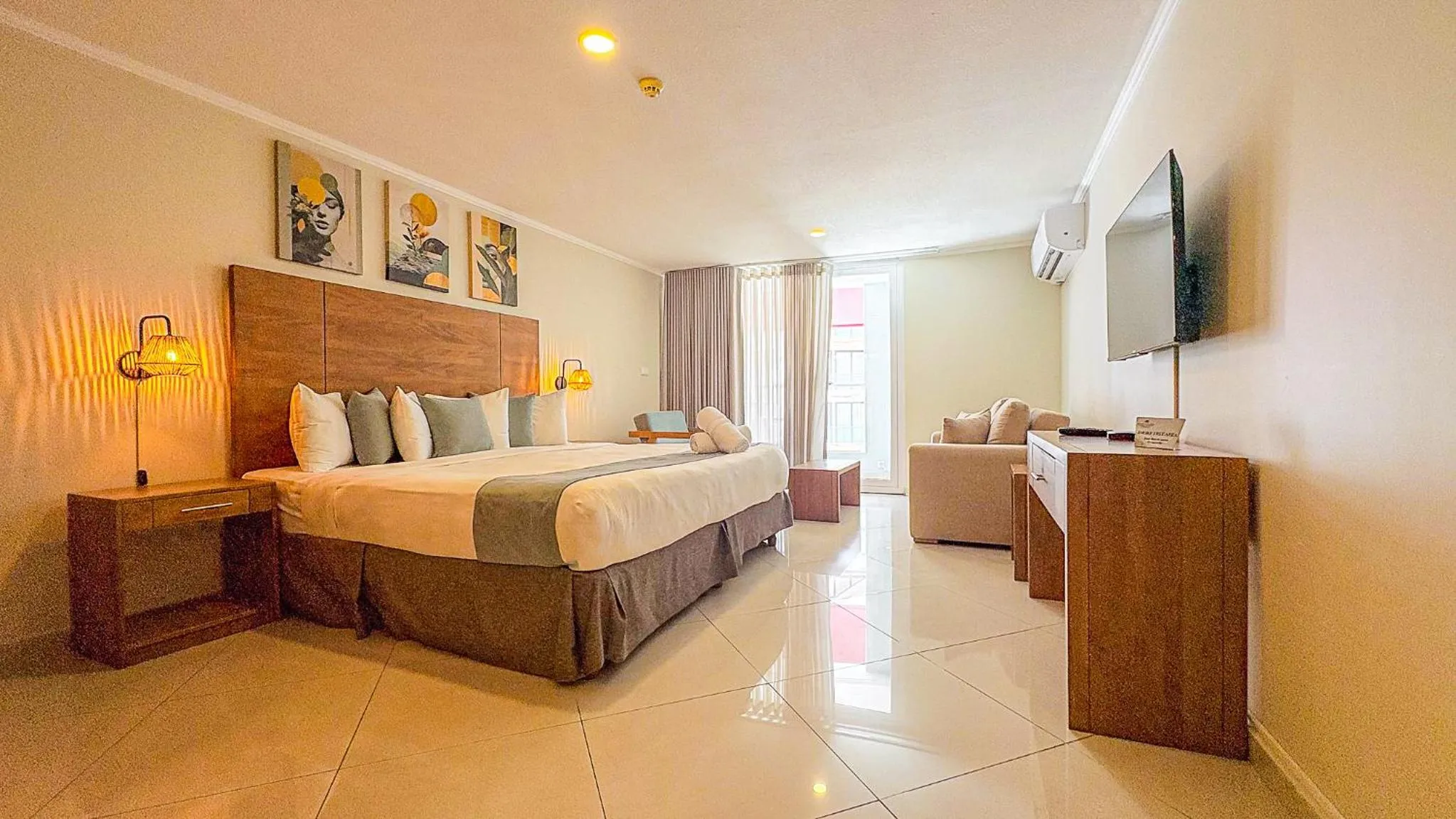 Bed in Majestic City Suites & Beach Hotel