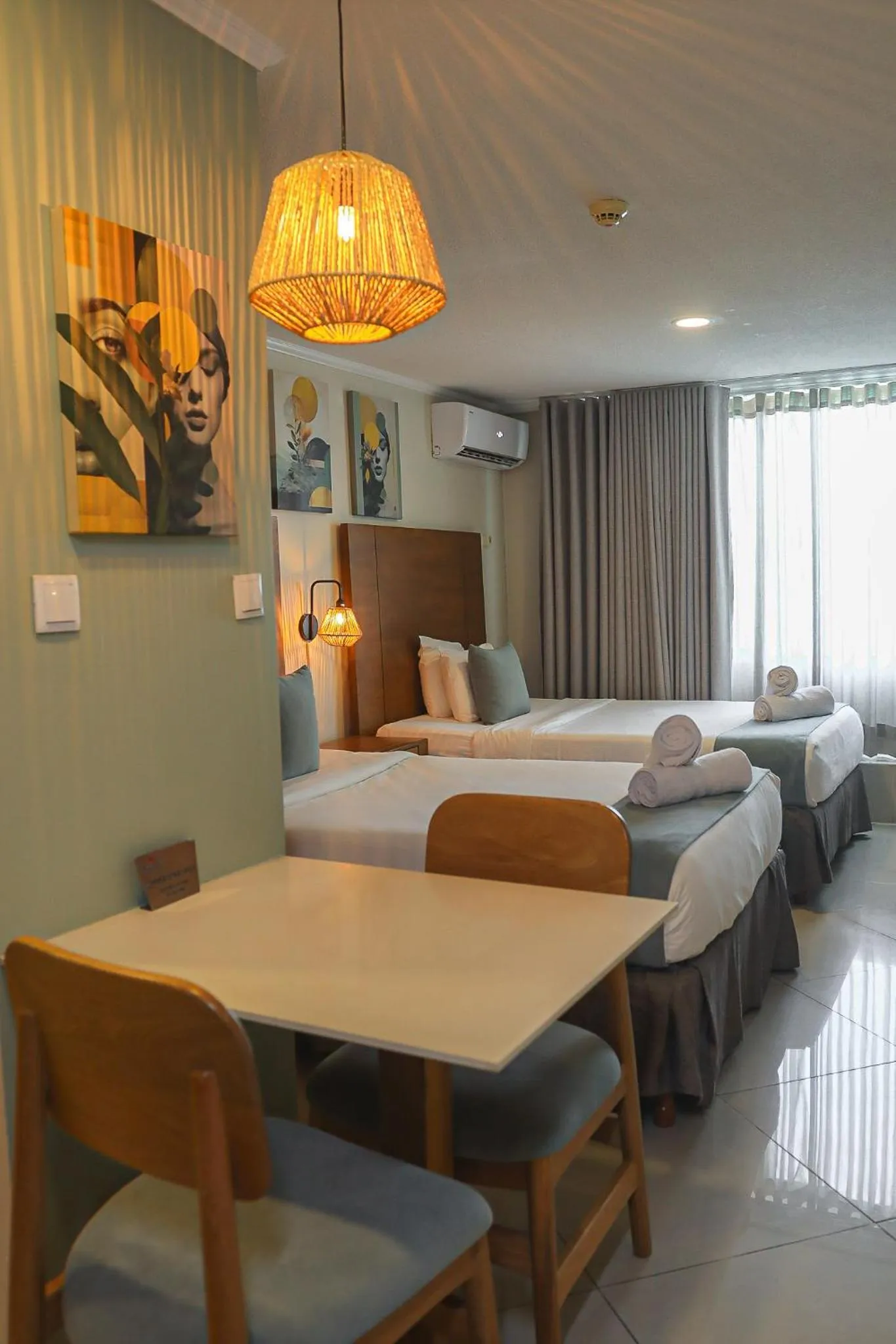 Bed in Majestic City Suites & Beach Hotel