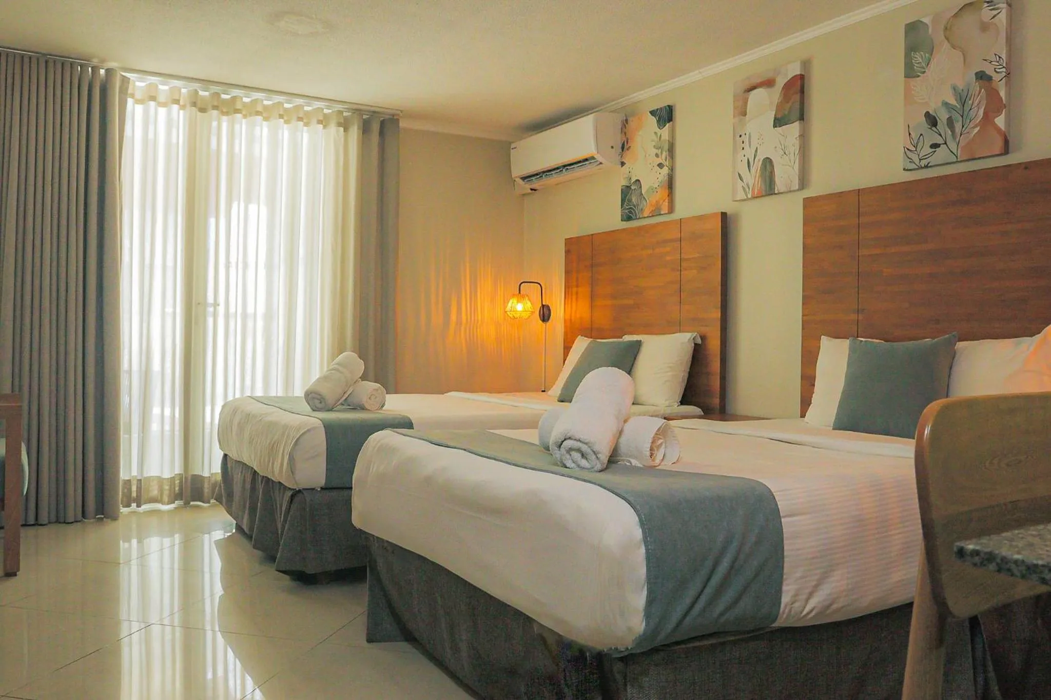 Bed in Majestic City Suites & Beach Hotel