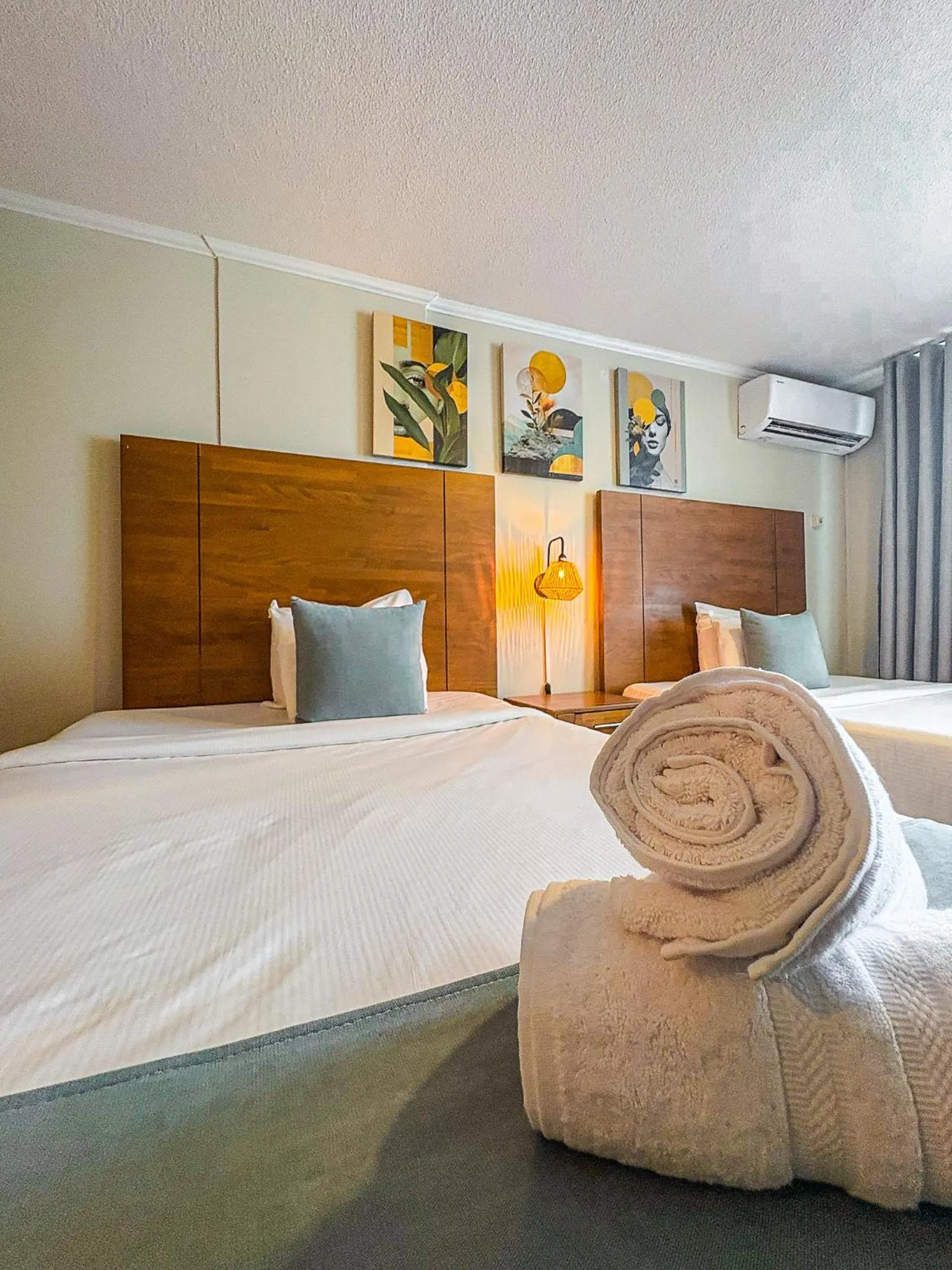 Bed in Majestic City Suites & Beach Hotel