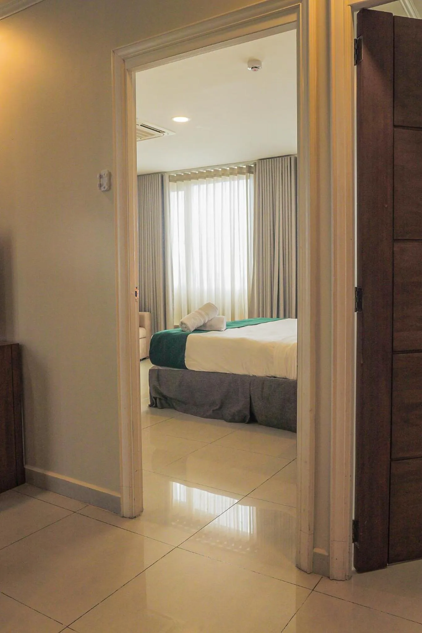 Bed in Majestic City Suites & Beach Hotel