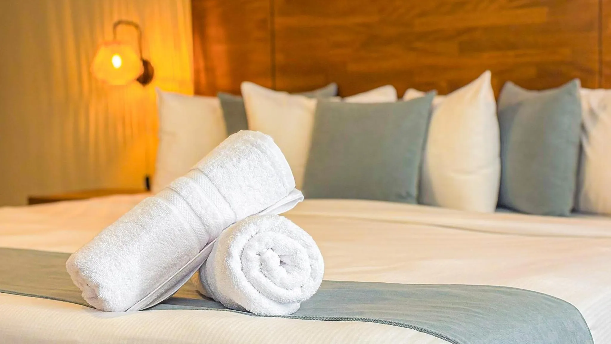 Bed in Majestic City Suites & Beach Hotel