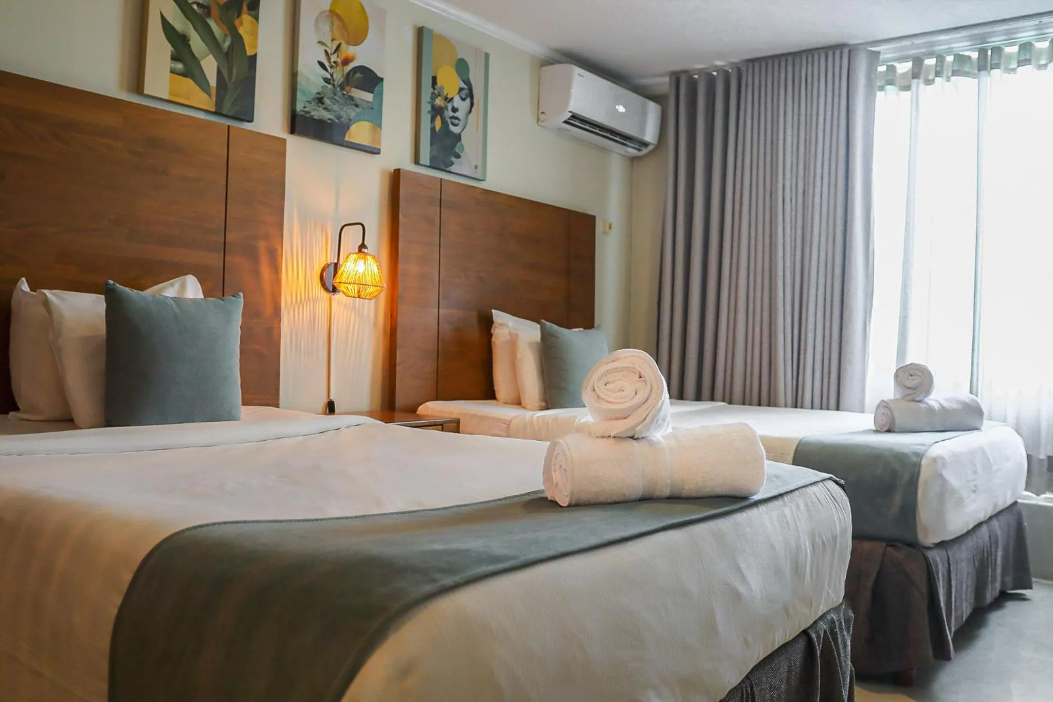 Bed in Majestic City Suites & Beach Hotel