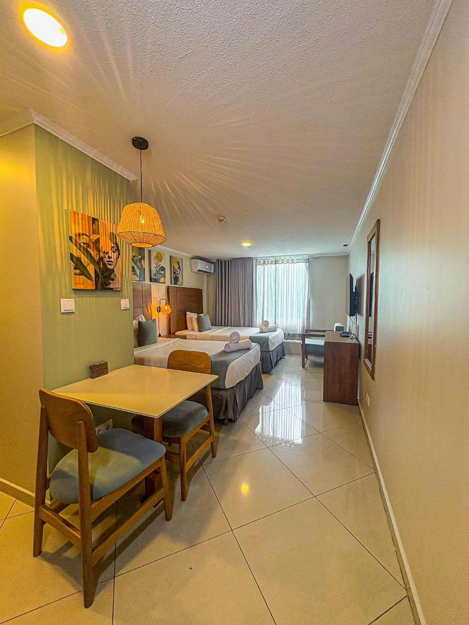 Bed in Majestic City Suites & Beach Hotel