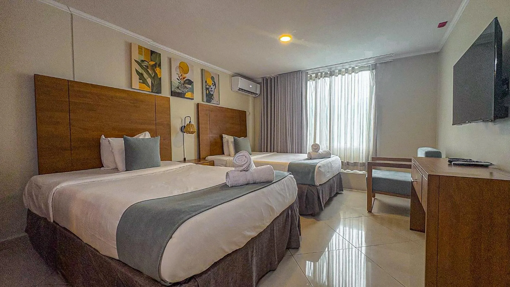 Bed in Majestic City Suites & Beach Hotel