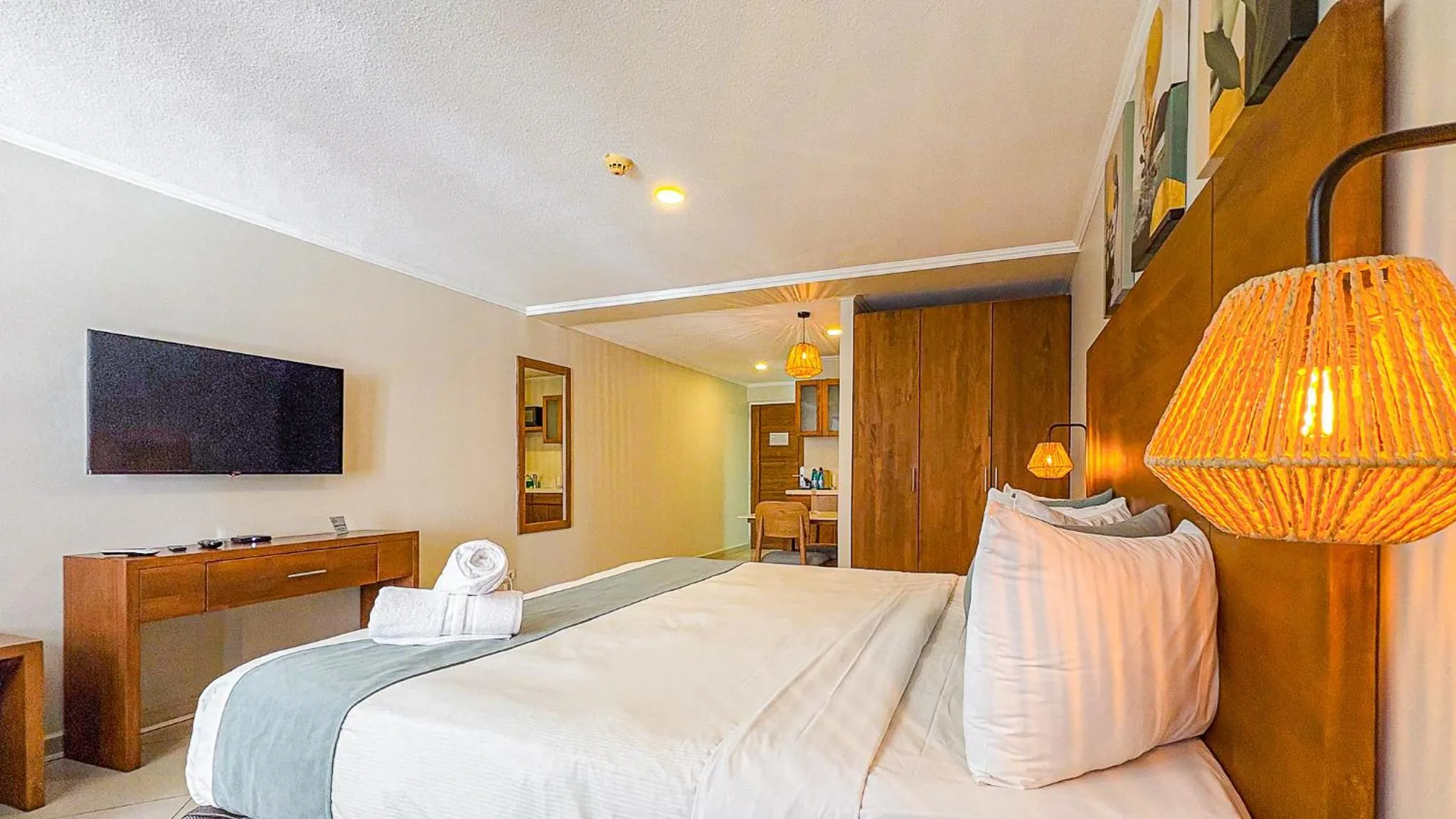 Bed in Majestic City Suites & Beach Hotel