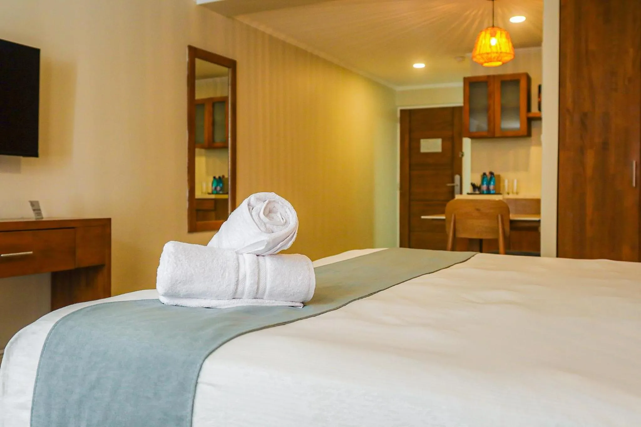 Bed in Majestic City Suites & Beach Hotel