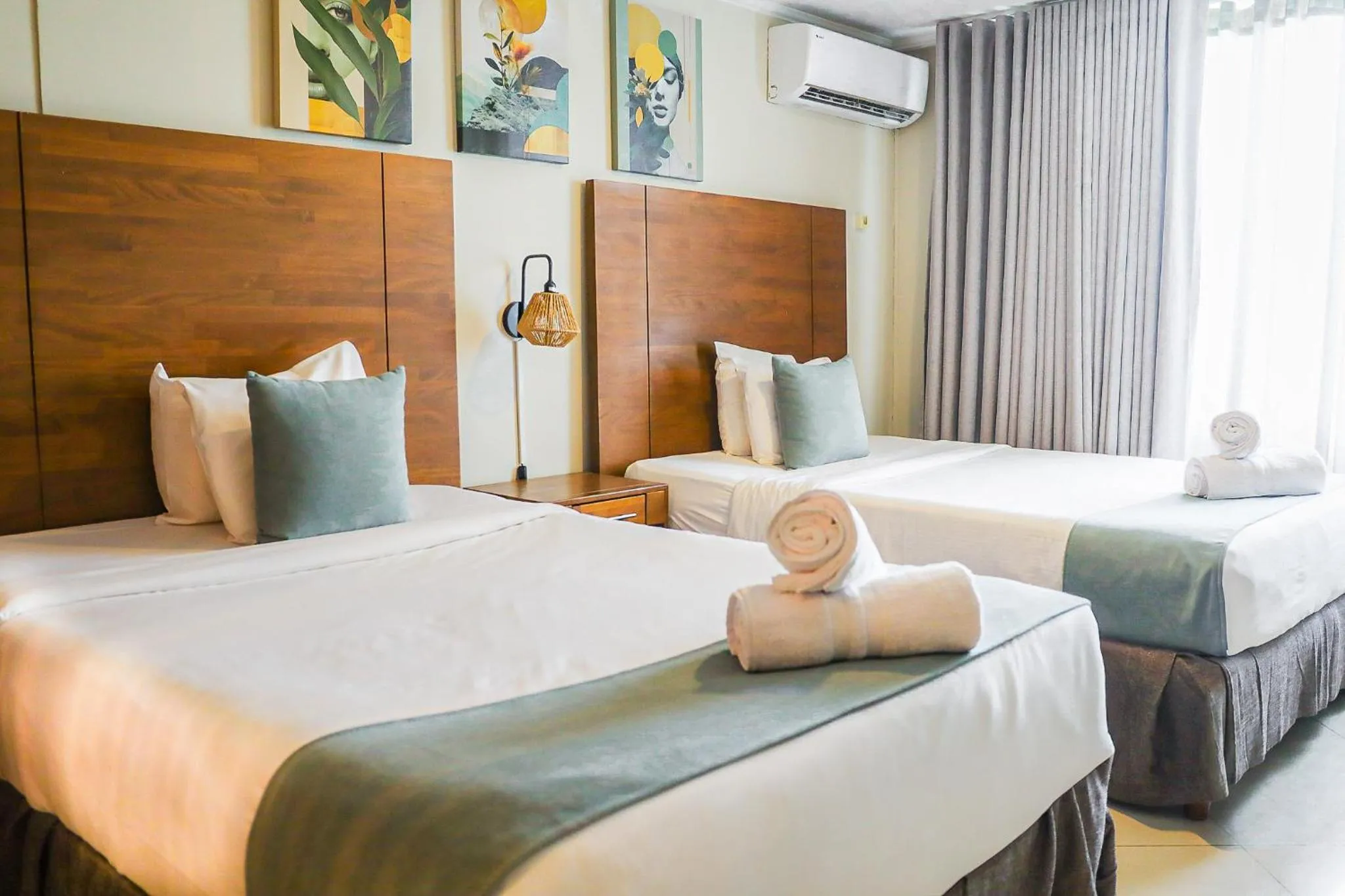 Bed in Majestic City Suites & Beach Hotel