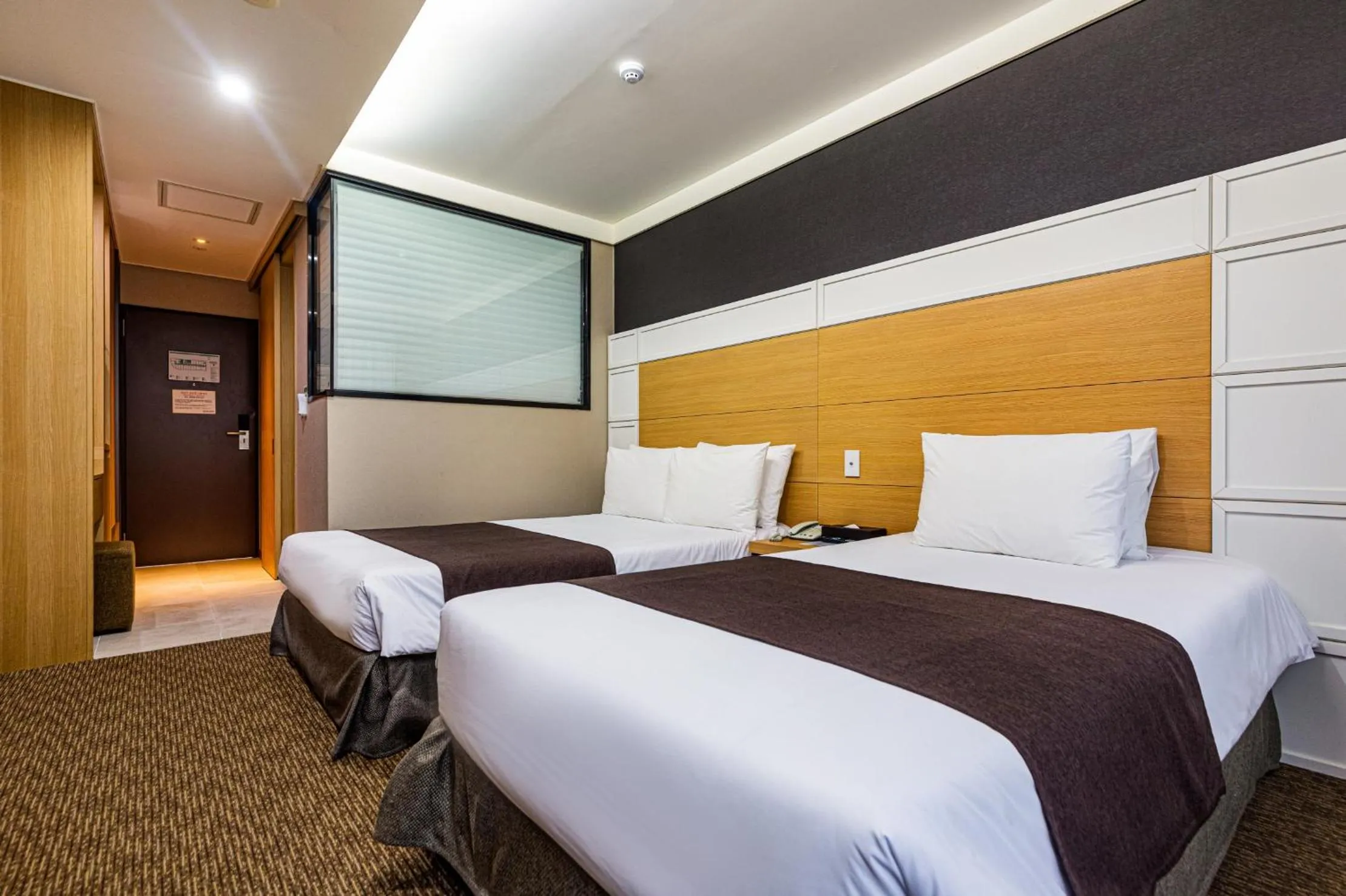 Bed in Eastern Hotel Jeju