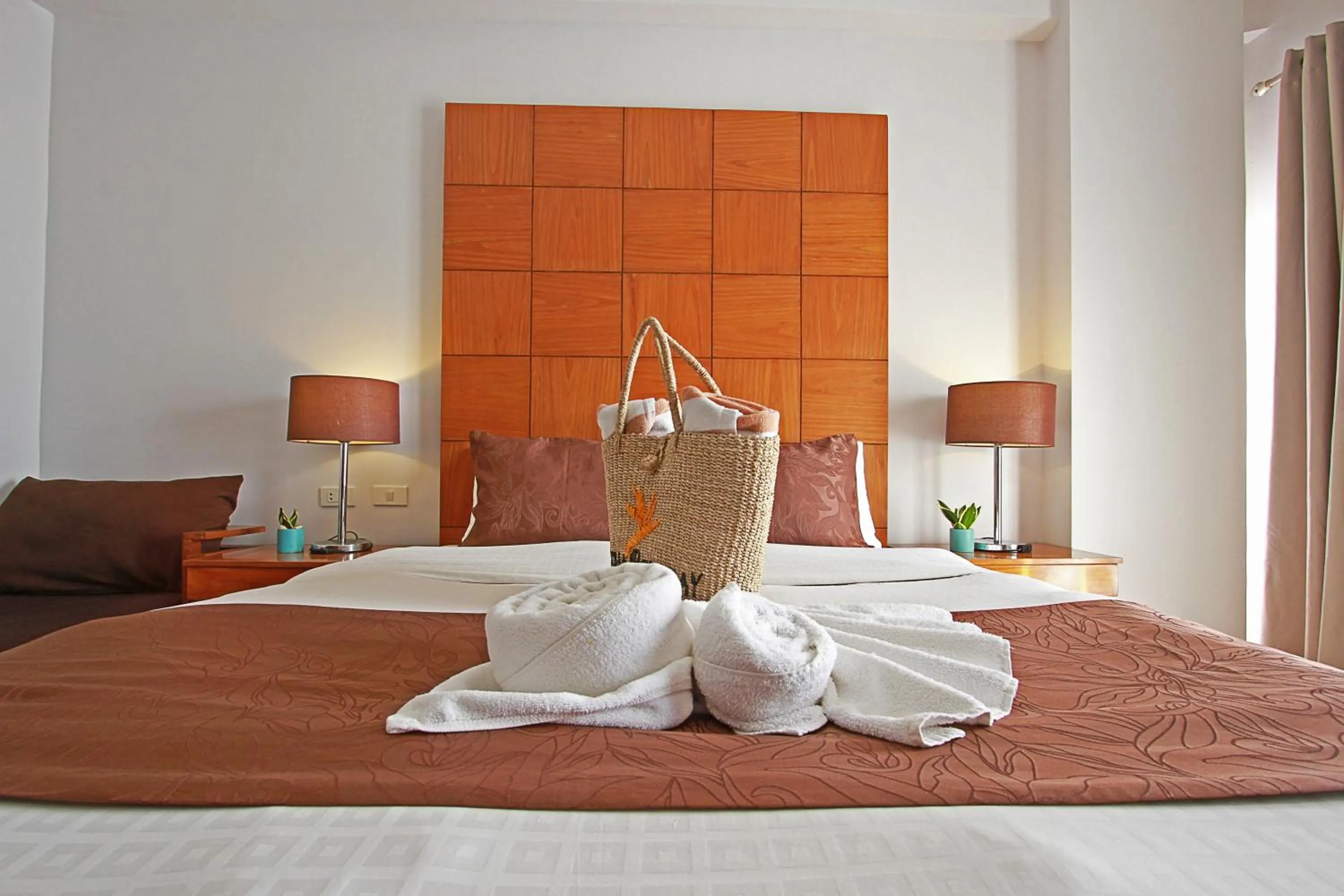 Bed in Aloha Boracay Hotel