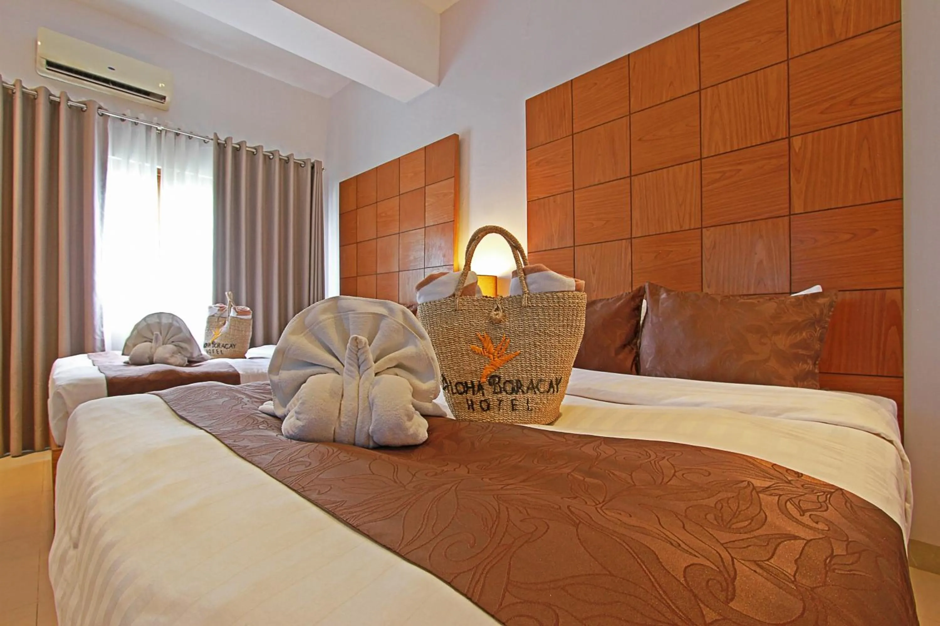 Bed in Aloha Boracay Hotel