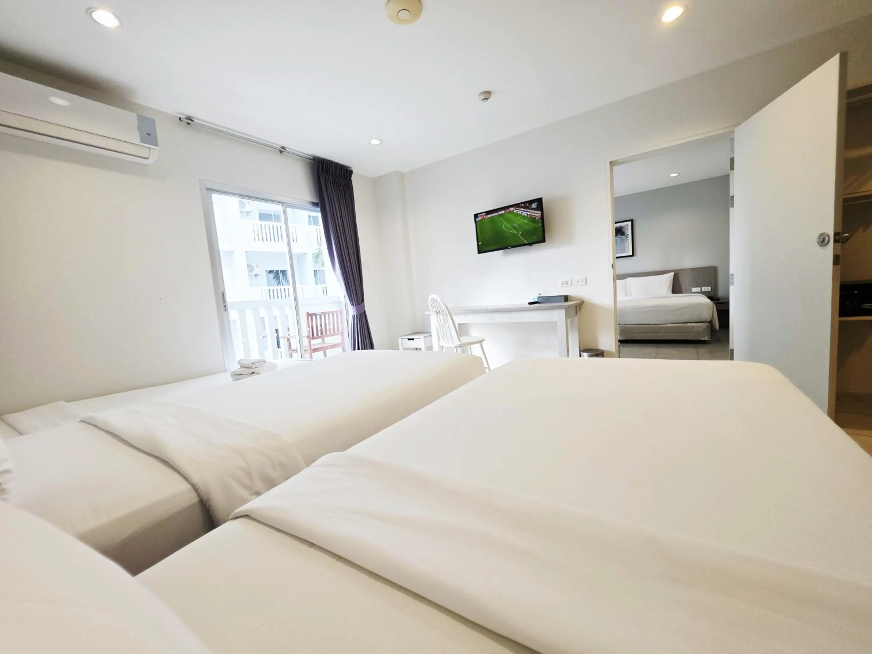 Bed in Recenta Phuket Suanluang by Deevana