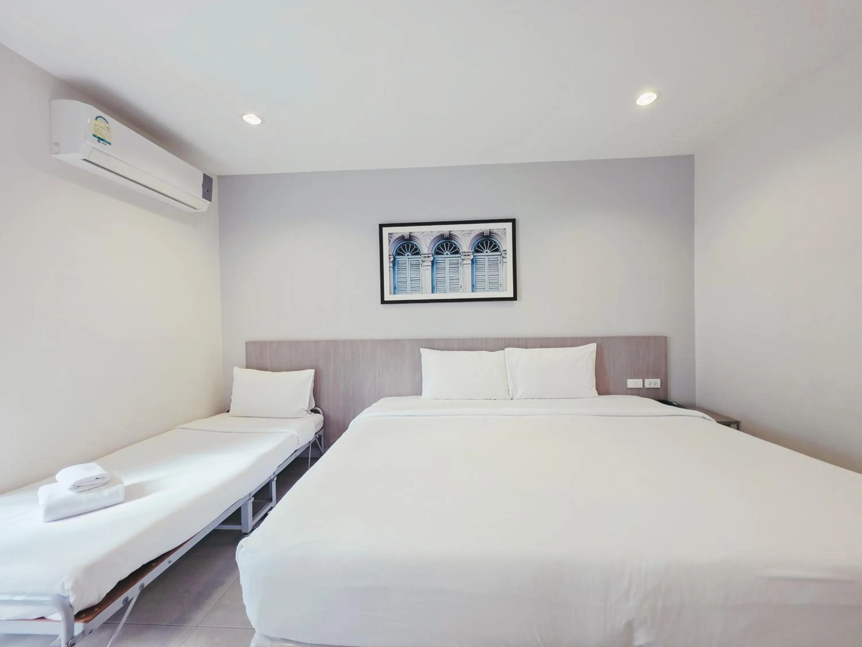 Bed in Recenta Phuket Suanluang by Deevana