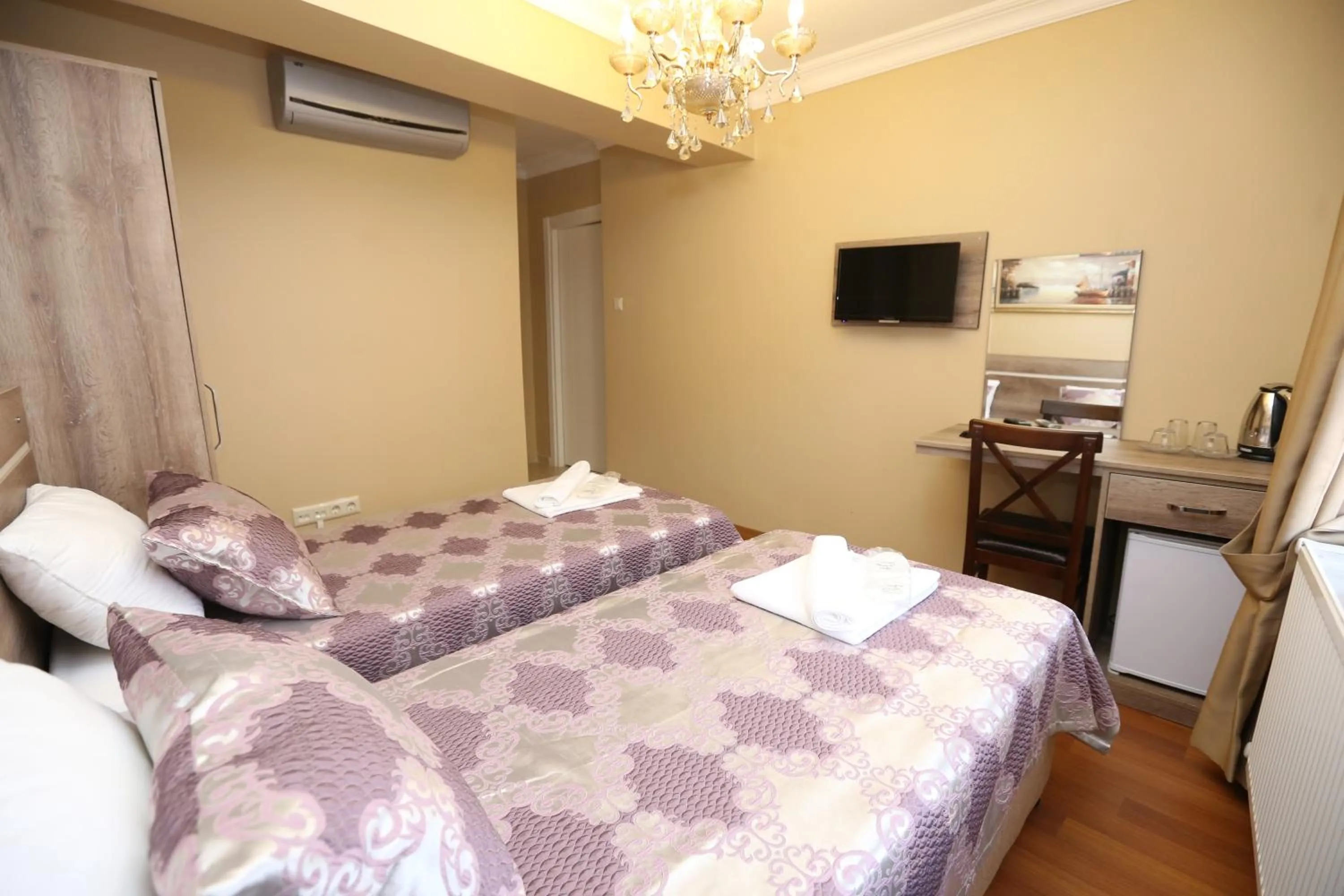 Bed in My Holiday Time Hotel