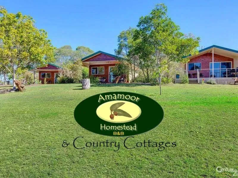 Property logo or sign in Amamoor Homestead and Country Cottages