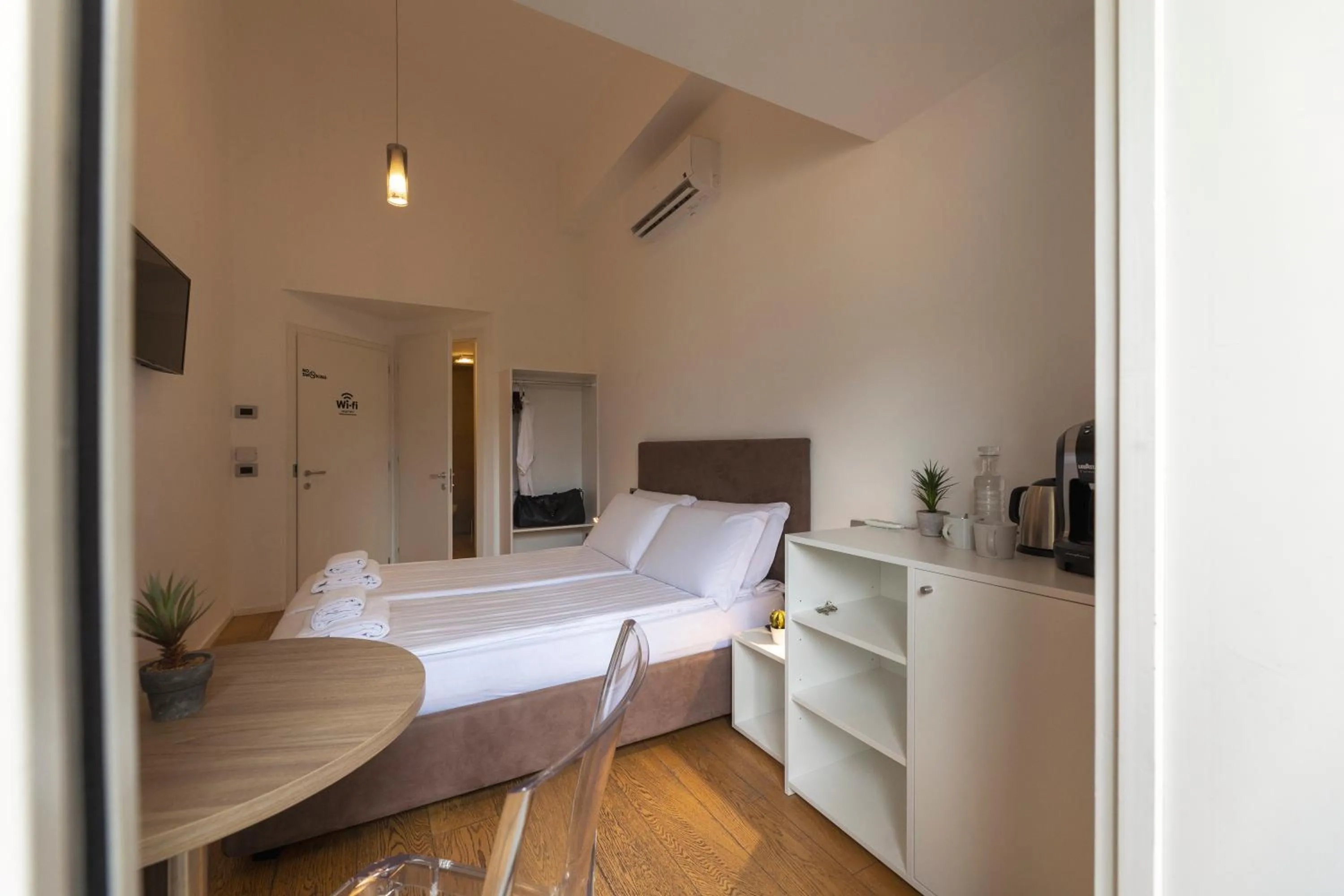 Bed in HEART OF TRENTO Loft & Rooms