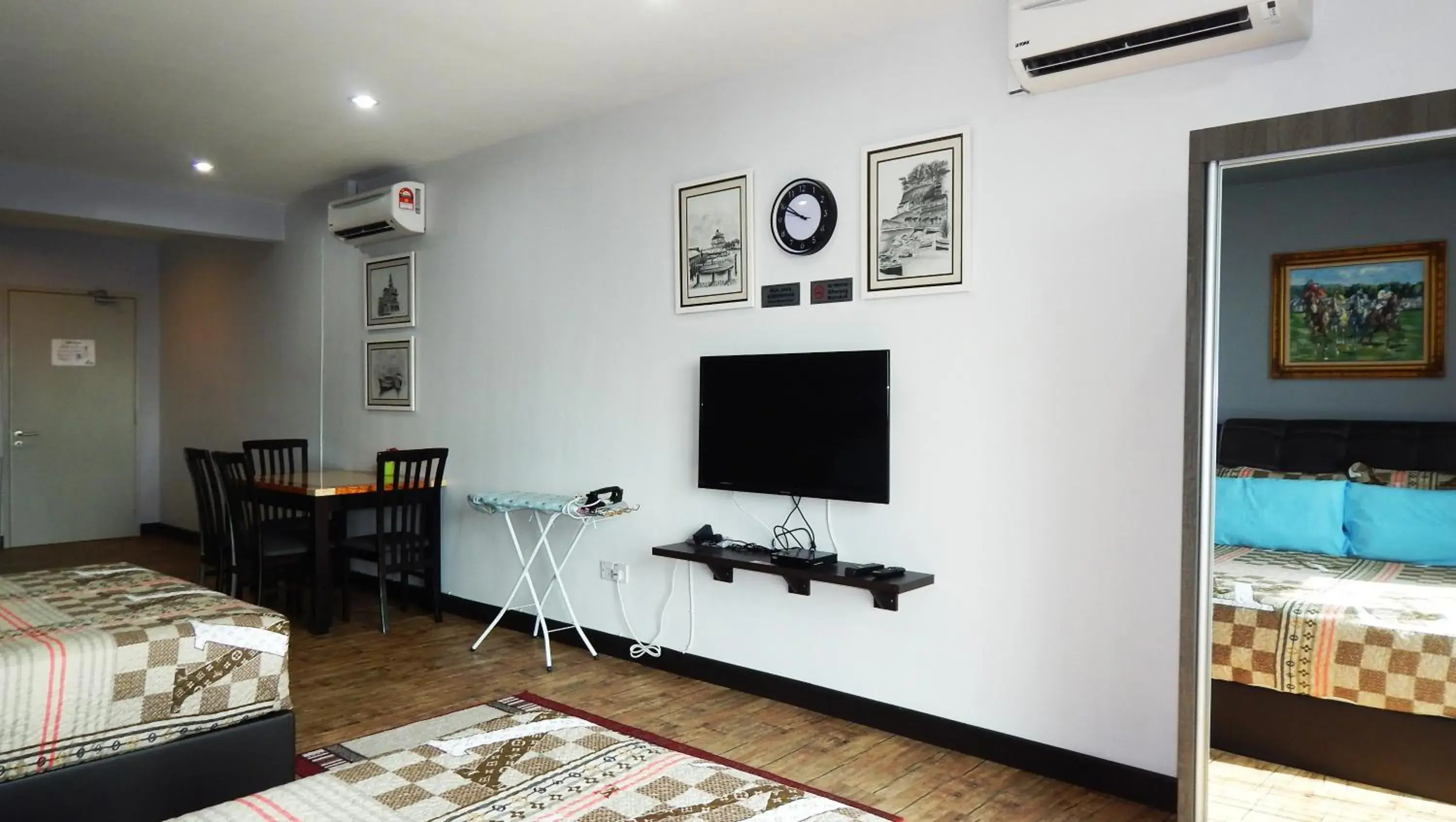 Bedroom, TV/Entertainment Center in Wadi Iman Guesthouse @ i-City