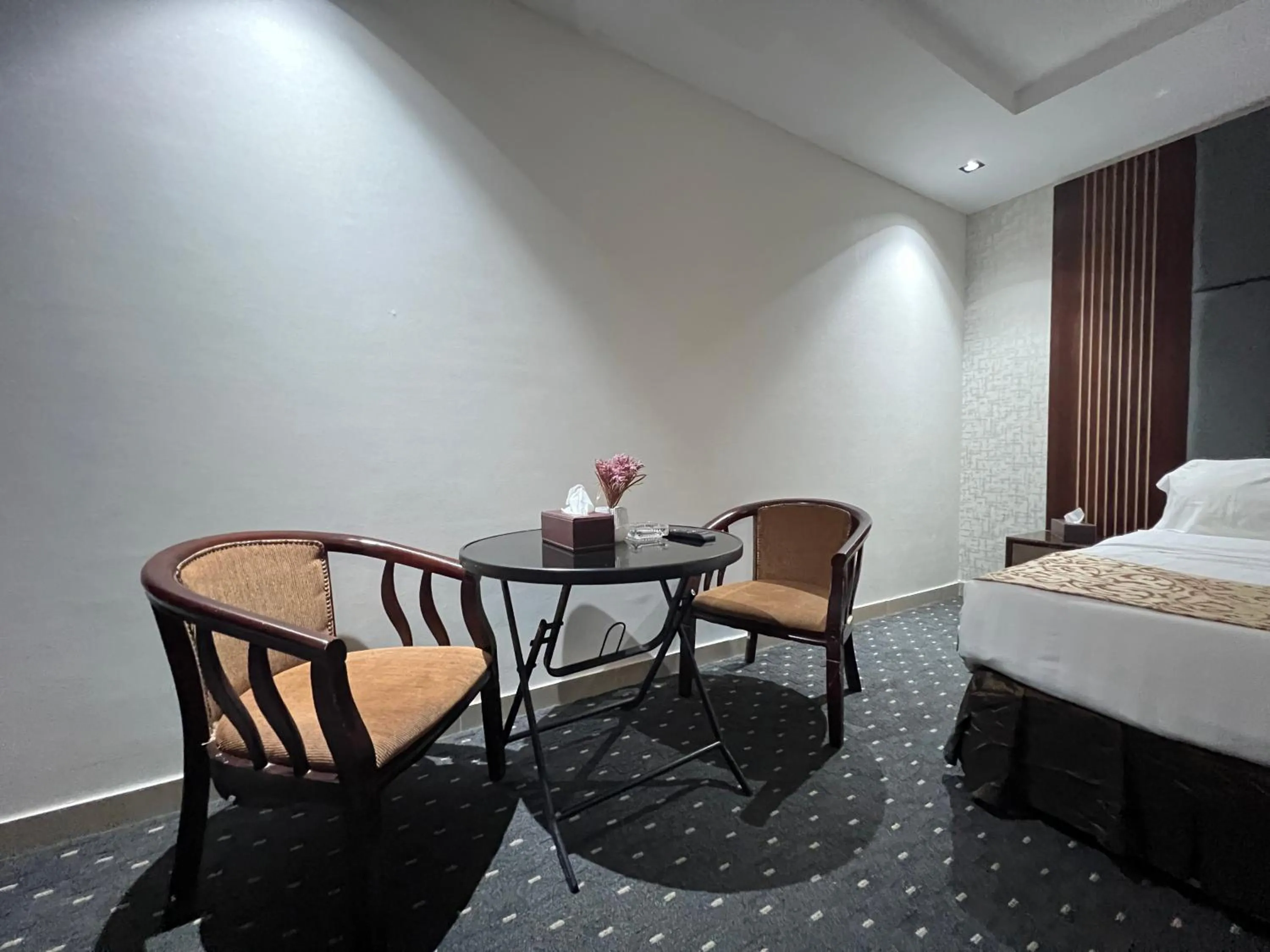 Seating area, Bed in Rose Star Hotel